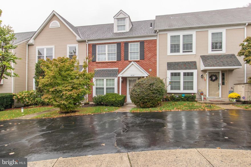 New Price! Welcome home to 419 Snowflake Circle, a beautiful 2-bedroom townhome nestled in the Regents Park neighborhood of West Norriton. Enjoy the peace and quiet of neighborhood living while being mere minutes away from restaurants, shops, golf courses and parks. From the moment you approach the home, you will fall in love with the classic brick exterior that will never go out of style. Step inside the entry way where you will find the main floor laundry area. The entire house has been repainted with neutral colors, sure to please any decorating taste! The large kitchen was updated back in 2010 to feature white cabinetry, neutral counter tops and ceramic tile flooring. Appliances include a built-in microwave, gas range, dishwasher and refrigerator. Two windows allow loads of natural light to stream inside and provides the perfect spot to add a small table. A powder room is conveniently tucked away on this level.  Continue into the spacious living/dining room area complete with gleaming floors and patio doors that lead outside to the backyard. Is outdoor space important? Check it off the list! The cement patio provides plenty of space for a patio table and grill. Add an outdoor rug, a container garden for those with a green thumb, and some furniture and get ready to enjoy your own private oasis. Both bedrooms are located on the second floor and each contain new plush carpeting, and good closet space. The larger of the two bedrooms features two sets of closets! The hallway bathroom has a new dual sink vanity, ceramic tile flooring, and a tub shower with tile surround. Our favorite part of the home? The bonus finished 3rd floor loft! There are some many options for this room. Turn it into a spacious 3rd bedroom, a home office, a TV/media room, you name it! The possibilities are endless. The roof was replaced in 2018 and the windows have been recently replaced! Why wait? If you are looking for low maintenance living in a move-in ready townhome, this is a must see! Call us today to schedule your private tour.
