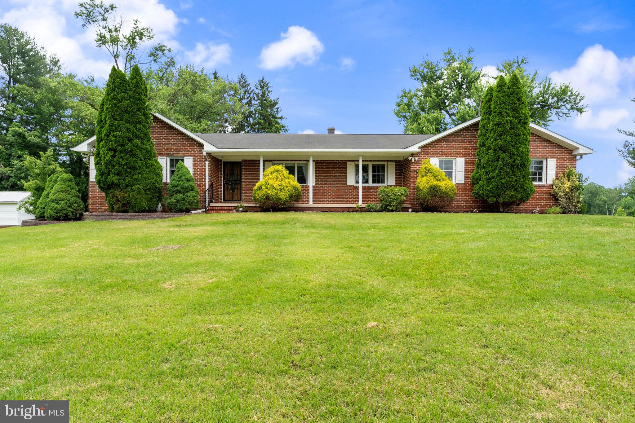 You will love this spacious rancher on just under 2 acre level lot. Walking into the home you have an open space with huge living room with a fireplace that is open to kitchen and dining room. The master bedroom has his and her closets and a full bath. There are two additional bedrooms and another full bath. The kitchen and bathrooms have been updated and the home is freshly painted. The home has wood floors and crown moldings throughout living and dining rooms. There is a huge family room added to the back of the home with great light and tons of space. There is also a separate room for laundry. The basement is huge and waiting to be finished with lots of room for storage. This home is handicapped accessible along with a two car attached garage. It also has a back up generator. One-year home warranty included.