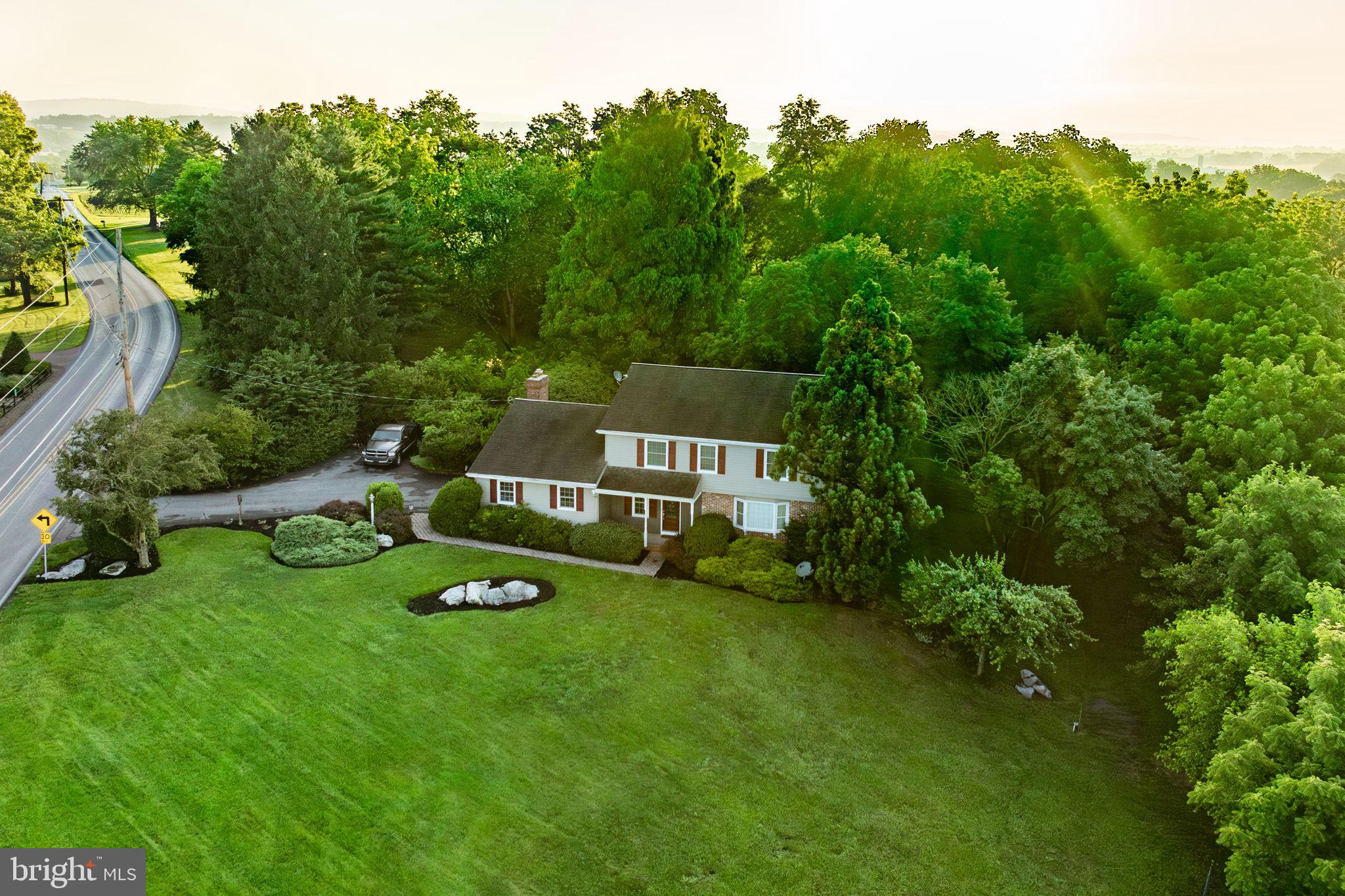 AUCTION PROPERTY. Auction date is Saturday, September 27th @ 10AM. List price is opening bid price only and is not indicative of the final sale price. TERMS: 10% down day of auction, balance 60 days or before. Buyer pays both transfer taxes (2% of sale price). REAL ESTATE: Rural custom built 2 story Colonial w/3606 SF finished area, eat-in kitchen w/oak cabinets & appliances, dining room, 1st floor family room w/brick wall & fireplace, 4 bedrooms + 2 bonus rooms, 2 ½ baths *master bedroom suite w/9x9 bath & walk-in closet), finished daylight basement/lower level w/walk out door, rec room w/kitchenette, appliances, full bath, utility room, heat pump, central AC, deck, porch & 2 car garage all on 1.6 ACRES w/farmland boundary. ZONED AG. NOTE: After 50 years in Wiest family, owner serious to sell. One owner custom built house. Ideal country location. Minutes to Ephrata, Brickerville & Brunnerville, Spacious 1.6 ACRE lot. OPEN HOUSE DATES: Saturday, September 6 & 13 from 1 to 4PM.