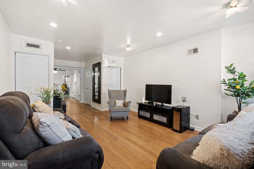 MOTIVATED SELLER...SELLER IS OFFERING  $5,000 towards an interest rate buy down and a 1 YEAR HOME WARRANTY with an accepted offer!  Welcome to this charming and beautifully refreshed Philadelphia row home that's filled with light and character. Enter the front door into the open concept living room with wood flooring, hi hat lighting, ceiling fans, and over-sized windows. The living room leads seamlessly down a hallway past a convenient half bath and into the dining room area with a ceiling fan and hi hat lights of it's own.. Through a doorway from the dining room leads to an updated kitchen with bright white cabinetry, stainless steel appliances, and a bright open sliding glass door directly to the private back patio space, perfect for hosting a BBQ or relaxing with family outside. Up the stairs surrounded by noise-cancelling walls, you'll find three cozy bedrooms and an updated full hall bathroom. The rear bedroom boasts access to a beautifully refinished deck overlooking the patio and the front master bathroom offers a full en suite bathroom. For even more space, the finished basement offers a mix of cemented space for storage, a dedicated laundry area, and a finished carpeted room perfect for home office, a bonus playroom. Located in the heart of Point Breeze within walking distance to Schuylkill River Drive, U Penn, CHOP and less than 10 minutes drive of I-95, I-76, PHL Airport, and downtown Philadelphia. Schedule your tour today!