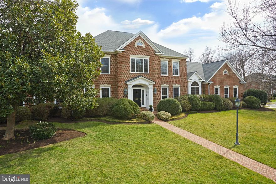 This is the one: AMAZING value for sure! Resting on an idyllic generous lot is this Georgian-style home w/soaring ceilings, gleaming wood floors, dramatic 2-story stone fireplace flanked by French doors to deck & pool (now open), state-of-the-art kitchen, adjoining breakfast rm, finished lower level with guest suite & recreational areas plus 3-car garage. Prime location, close to schools/work/fun!