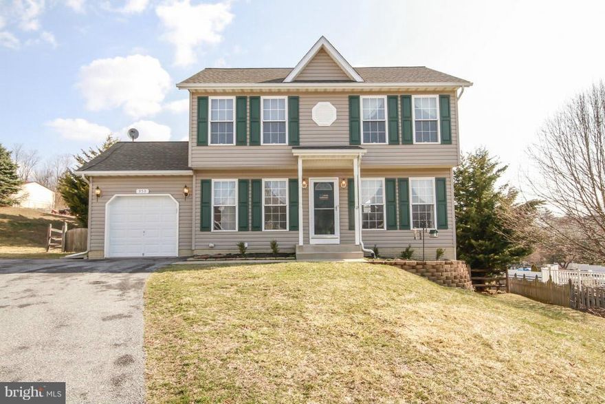 Bright cheery home w/ large windows.  Kitchen opens to family room w/ sliders to 14x20 deck & fully fenced yard. Wood floors throughout first floor including first floor laundry room. 42" oak kitchen cabinetry.  Center island.  Fully finished lower level with extra room and half bath. All appliances stay including extra freezer. Large back yard w/ play set. Located on a cul-d-sac.  Move in ready.