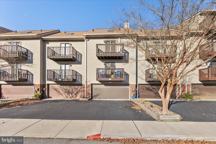 Downtown Ocean City. Walk to the White Marlin Open weigh-ins, Boardwalk, Concerts, Beach, Bay and all the region has to offer without ever driving in your car. Garage space for your vehicles/beach items and off street parking. The home is exceptionally well maintained with many updates and ready to host your family and friends.Private fenced tennis/pickleball court and multiple decks/patios for outside enjoyment. A unit of this size and offering is rare in this location. Two fireplace for year round enjoyment including one in top floor suite. Mid unit for very economical utility costs. Peek a boo Bay views from the home. En suite bathroom for primary bedroom and three showers in the home make for easy guest entertaining. Includes a full shower for the sandy beach days as you enter the garage/mudroom level. Upgraded trim/moulding/doors thoughout elevate this home. Full cedar lined closet in primary bedroom with automated lighting is just a hint of the elevated living throughout. Schedule your showing today as this home is outfitted and priced to sell quickly. Seller will include partial furnishings.