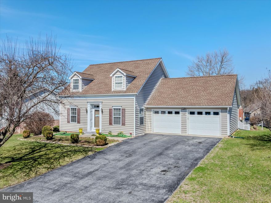 This classic Cape Cod home has been beautifully maintained. The moment you pull up you are captured by the curb appeal. The long driveway provides off street-parking in addition to your attached two car garage. Inside you are greeting by hardwood floors and vaulted ceilings in the spacious living room. This space features large windows and a dormer skylight for tons of natural light. Those hardwood floors carry into your kitchen and dining. The kitchen features oak cabinet, easy-care vinyl counters, all of your appliances, including the much sought after gas range. The kitchen opens into the dining room. This is a perfect set up if you like to entertain! The dining room features a decorative light fixture and access to your garage. The proximity makes unloading groceries a dream. Sliding glass doors lead out to the lovely screened in porch. Down the hall we have the laundry closet with machines neatly tucked away. There are 2 generously sized bedrooms on the main level with carpet, overhead lighting, and ample closet storage. Bedroom includes the added bonus of a ceiling fan. The hall bath features an extended single bowl vanity, LVP floors, and a 5 ft acrylic tub/shower. Upstairs you have a large loft overlooking the living room with vaulted ceilings, ceiling fan, and large storage closet. This could be a great little reading nook! The large bonus room on features carpet and overhead lighting. You could use this for storage, an office, or a playroom - tons of potential! The large primary suite features carpet vaulted ceilings and ceiling fan. It includes a large walk-in closet and private ensuite bathroom. Your ensuite features a 40 in single bowl vanity and medicine cabinet for ample storage. The space is completed by easy-care vinyl floors and a 5 ft acrylic tub/shower. Outside you have a large ,screened porch with ceiling fan light fixture. This allows you to enjoy the warm months with out the sunburn or the bugs. But if you are looking for a little more sunshine, it opens to the concrete patio. This is the perfect spot to host those upcoming Summer BBQs. Beyond this your fenced yard includes raised garden beds and a paver patio for even more outdoor living space. This home has everything you're looking for and more! Schedule your showing today!