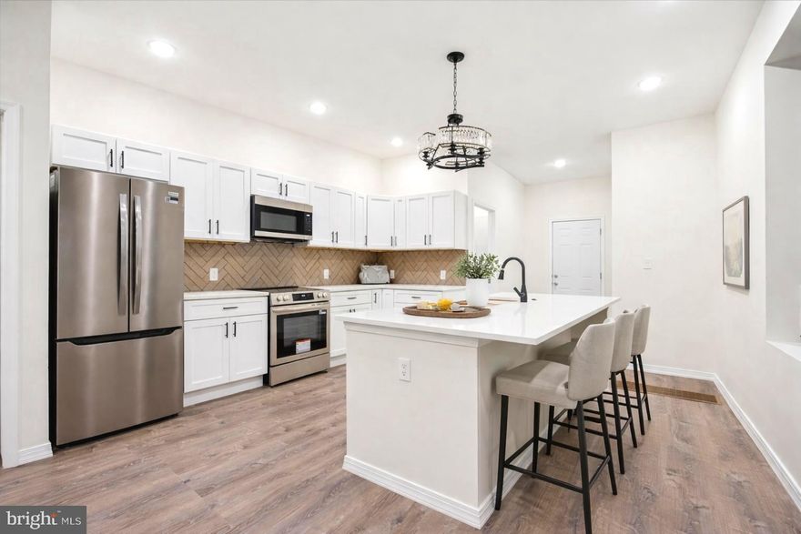 Discover this beautifully renovated six-bedroom home in Carroll Park, one of West Philadelphia’s best-kept secrets. Seamlessly blending timeless character with modern luxury, this impressive residence features soaring ten-foot ceilings, new windows, elegant finishes, and a thoughtfully designed layout that feels warm and inviting from the moment you enter. The main level offers an expansive open concept living and dining area, ideal for entertaining. The gourmet kitchen is a standout, showcasing high-end appliances, premium materials, new cabinetry, a farmhouse sink, a central island, upgraded countertops, and a stylish backsplash. Step directly from the kitchen into the newly refreshed, fenced backyard—perfect for hosting gatherings or enjoying a quiet morning coffee. A convenient main-floor washer and dryer, along with a spacious bathroom featuring a ceramic-tiled shower, add everyday functionality.
Upstairs, the primary suite provides a serene retreat with a large walk-in closet and a luxurious en-suite bathroom. Three additional generously sized bedrooms and another full bath complete this level. The renovated bathroom impresses with a full mirror equipped with built-in defrost and Bluetooth audio, along with a versatile multi-function shower head. The finished basement expands the home’s versatility, offering two additional bedrooms and an entertainment area—ideal for guests, a home office, or an in-law suite. Brand-new systems and custom finishes throughout make this home truly move-in ready.
Located on a wide, tree-lined street with ample parking on both sides, the property sits between two major parks and playgrounds. Nearby amenities include a public pool, basketball courts, a roller-skating park, and a football field. Conveniently close to schools, shopping, dining, and public transportation, this exceptional home offers the perfect balance of urban convenience and suburban tranquility.
*Some photos are virtually staged to help visualize the space; furnishings are not physically present*