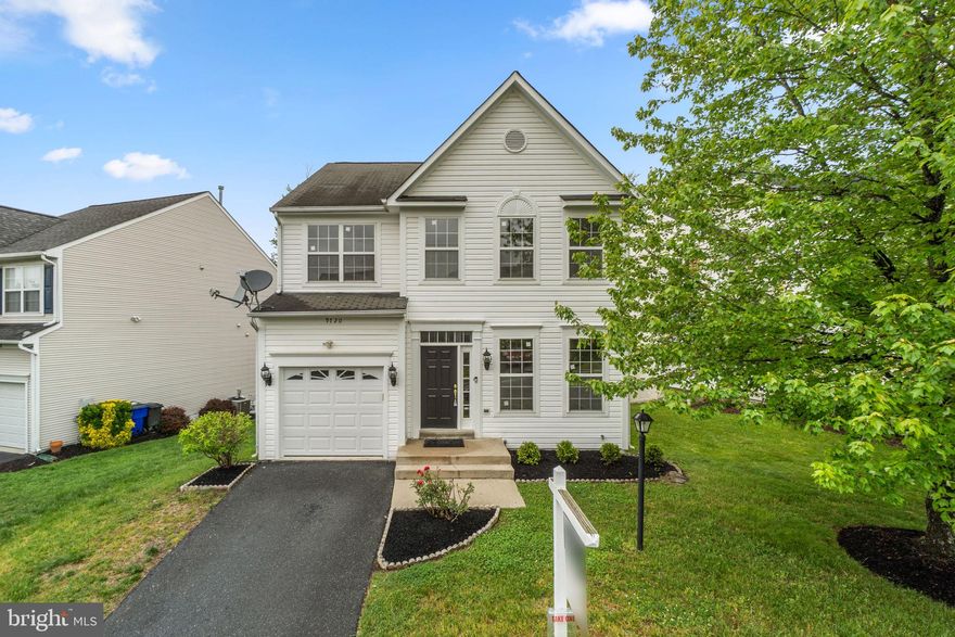 Charming Colonial residence offering 4 bedrooms, 3.5 bathrooms, and 2,612 finished square feet in desirable Spring Ridge. // Welcoming front landscaping leads to a bright foyer that opens into a spacious combined living and dining area accented by a chandelier. An arched doorway continues into the inviting family room featuring a fireplace and direct access to the deck. // Completely open to the family room for seamless indoor-outdoor entertaining, the updated kitchen features a central island with breakfast bar seating, stainless steel appliances, a custom backsplash, ample cabinetry, and generous counter space. A convenient powder room completes the main level. // Upstairs, the upper level includes three carpeted bedrooms, two full bathrooms, and a laundry closet. The spacious primary suite showcases vaulted ceilings, a walk-in closet, and a private ensuite bath with a dual sink vanity, soaking tub, and separate shower. One of the secondary bedrooms also features its own private attached bathroom, and all three bedrooms include walk-in closets. // The walk-out lower level offers an expansive recreation room, a fourth bedroom, and a full bathroom, providing flexible living space for guests, entertaining, or everyday use. // Outdoor living is highlighted by a deck overlooking the fully fenced backyard, lined with garden beds and backing to woods for added privacy and a peaceful setting. // Residents enjoy access to community amenities, including a community pool.