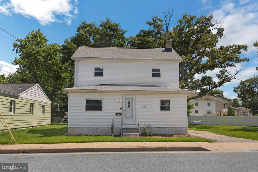 Spacious, versatile, and tucked into a peaceful Catonsville neighborhood—this 5-bed gem has it all! With 2 bedrooms and 2 full bathrooms conveniently located on the main level, plus 2 additional bedrooms and a full bath upstairs, the layout is ideal for multi-generational living, guests, or anyone looking for extra space. The fifth bedroom provides added flexibility—great for a home office, hobby room, or playroom.
The large kitchen has ample cabinetry, black appliances, recessed lighting, and plenty of counter space for meal prep or casual dining. Just off the kitchen, a bright sunroom welcomes you with hardwood flooring and oversized windows that fill the space with natural light. Comfortable living areas and bedrooms feature neutral carpeting, creating a cozy and inviting atmosphere throughout.
Additional highlights include a spacious walk-in closet, updated bathrooms with clean, modern finishes, and a traditional layout that balances open flow with defined spaces. Outside, you'll find a large yard with mature trees and 4-car parking. If you're upsizing or looking for a place with room to grow, this charming Catonsville home is ready for you.