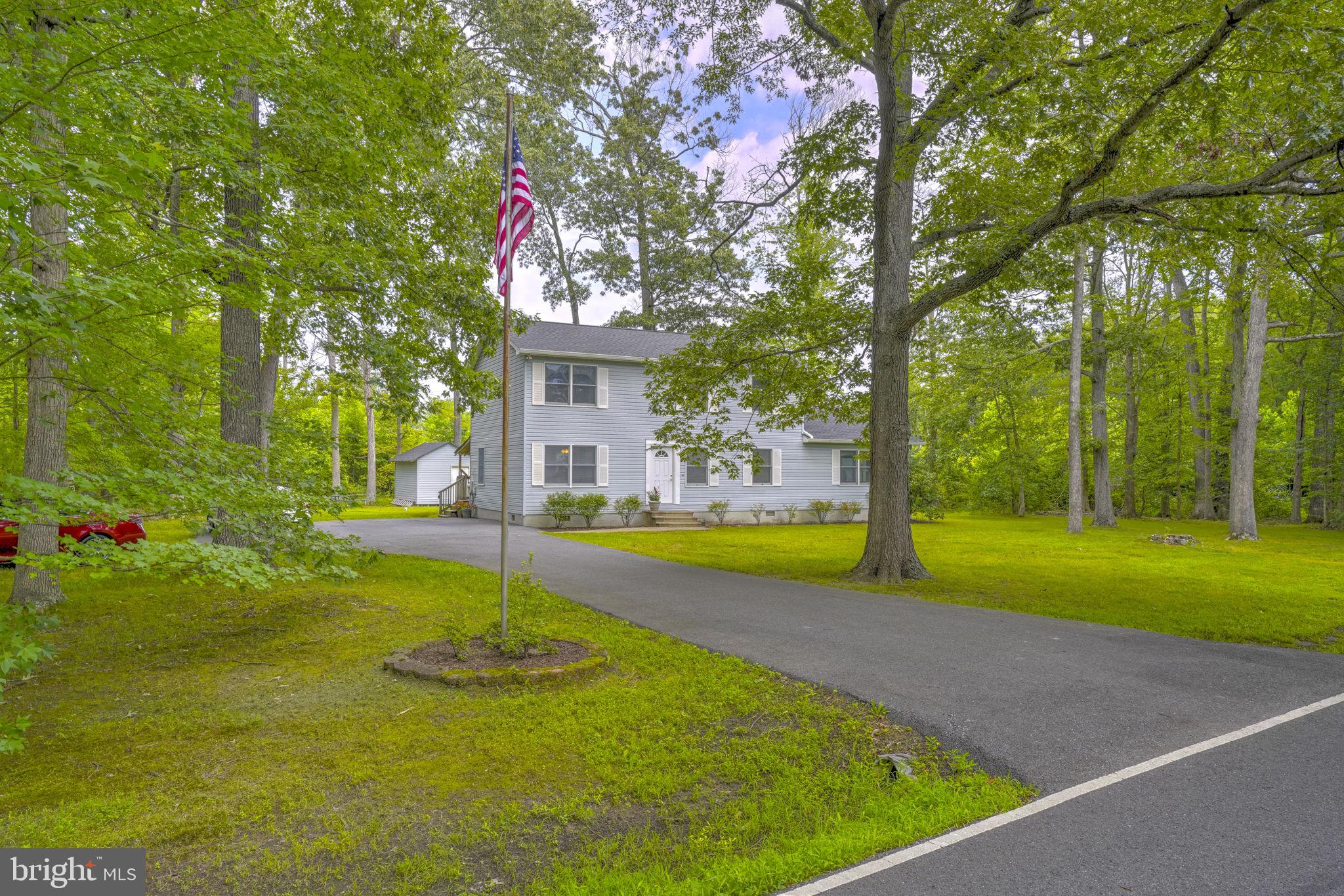 Move-in Ready! Just pack your bags and settle into this beautifully maintained and thoughtfully upgraded home, perfectly situated on two spacious lots totaling 0.61 acres. Enjoy brand new hardwood floors and carpeting (2025), a stylishly updated kitchen and dining area (2021), and a renovated full bath on the main level (2015). The formal living room features gleaming hardwood floors, while the generously sized family room offers ample space for relaxing or entertaining. Upstairs, you’ll find three comfortable bedrooms and an updated full bath (2024). The original fourth bedroom has been converted into a large laundry room but can easily be restored to create a fourth bedroom once again. Additional highlights include a new roof with gutter guards (2022), and plenty of parking—perfect for your boat or RV. With no covenants or restrictions, you’ll have the freedom to truly make this property your own. Tucked away in a private setting, yet just a short walk to the brand-new Deale Park, public library, waterfront restaurants, and more. Don’t miss this rare opportunity to enjoy comfort, convenience, and charm all in one place!