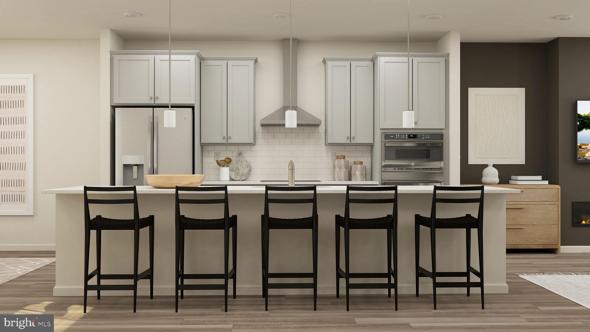 Hard hat tours available now, move-in ready November 2025! Gorgeous luxury stacked townhome with 3 bedrooms and 2.5 baths with an incredible gourmet kitchen in the brand new Ashberry Community.
This gorgeous luxury townhome-style home has 2 levels and 2,415 sqft of living space. Walk up the stairs into the open concept great room area with tons of natural light and a featured fireplace with recessed lighting and a pantry. This upgraded gourmet kitchen includes a stainless steel french door fridge, double oven, and a cooktop with a hood. The massive kitchen island is the heart of this home and takes center stage supporting plenty of counter space and storage (including a pantry). It’s the perfect space for entertaining. There’s also a powder room, private office, and deck right off the open concept living area on the main level. Up the stairs to the upper level, you’ll find the spacious owner’s suite is full of natural light, features a vaulted ceiling, and recessed lighting. The spacious owner’s bathroom inspires a spa experience with a double vanity, modern finishes, and standing shower. The in-unit laundry room with washer and dryer is close to the bedrooms, keeping it extra functional. The remaining 2 bedrooms are also full of natural light and share a large full bath in the hall with a tub. There’s also tons of storage with an owner’s walk-in closet and closets in each bedroom. This unit includes 1 parking space in the garage, which features an EV charging station rough-in. Also within walking distance to Old Town Manassas with its vibrant local shops, restaurants, and nightlife that regularly host weekend events. Stay close to the Metro DC area without the traffic or choose the Virginia Railway Express (VRE), also close by. Join a community full of first responders and teachers. Whether you’re downsizing, investing, or a first-time homebuyer leveling up, this is the perfect townhome-style opportunity with the superior construction Lennar provides. Take advantage of $20,000 in closing costs by selecting Lennar Mortgage.