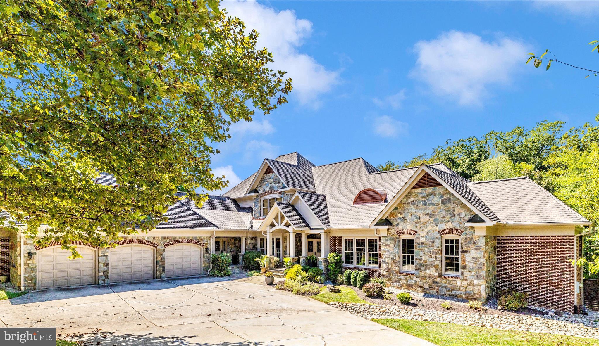 Welcome to this well maintained custom architectural masterpiece with over 9300 total finished square feet of resort-style living space and smart technology integration. From the moment you step inside, this custom-designed home delivers the WOW factor.
Soaring ceilings, massive railroad trestle beams with iron brackets, and walls of glass create a dramatic open floor plan with panoramic views of the resort-style pool and private backyard retreat. Blending rustic warmth with cutting-edge features, the home has a brand-new roof with gutter leaf guards and a transferable lifetime labor warranty.
It’s proudly recognized as Maryland’s first certified healthy home, featuring geothermal heating, a whole-house HEPA air filtration system, and a whole-house humidifier for year-round family health and comfort. Inside, the layout is as functional as it is breathtaking.
The main level features 4 or 5 bedrooms and 3 full custom designed baths and one-half bath. A grand loft overlooks the great room and is a sanctuary itself with an additional half bath. An integrated Polk & Klipsch audio system with ceiling-mounted subwoofer delivers cathedral-like sound in both the kitchen and great room.
The finished lower level includes 2 more bedrooms which can be used for family or Au Pair help with an additional 2 full professionally designed baths, a gym with exercise equipment (some of which conveys), and a media-ready rec room.
The luxurious primary suite includes a spa-like bathroom with modern oversized tile and a heated tile floor. The dual home office spaces provide everyone with a quiet place to work comfortably and privately from home. There is also a elevator reaching all 3 levels.
The chef’s kitchen is amazing and was designed by world-renowned architect Shorieh Talaat with entertainment on a grand scale in mind. It includes Wolf and Sub-Zero appliances, dual dishwashers, a smart microwave, a main, prep and coffee bar sink for a total of 3 separate sinks, making this a truly unique kitchen enhanced by sleek concrete countertops with ample prep space. This kitchen is capable of serving up to 50 guests.
Step outside to your own private oasis; the centerpiece is a showstopping custom pool surrounded by 2,000+ sq ft of cool-to-the-touch porcelain tile (a $250,000 project) and 10-person hot tub. The professional landscaping with dramatic stone boulders and forest conservation easement behind the home affords total privacy. The built-in outdoor kitchen offers effortless space for entertainment, and the fully fenced backyard is designed for comfort and seclusion.
Smart Home and efficiency features include: five-zone heating and cooling system with four smart thermostats, smart microwave, smart washer and dryer, whole-house intercom system, 360° smart security surveillance system, automatic natural gas-powered whole-house generator, garage doors with app-controlled access, and a garage refrigerator.
This is a rare opportunity to own a home that combines architectural excellence, advanced smart-home technology, energy efficiency, and resort-style amenities—all in one unforgettable property.