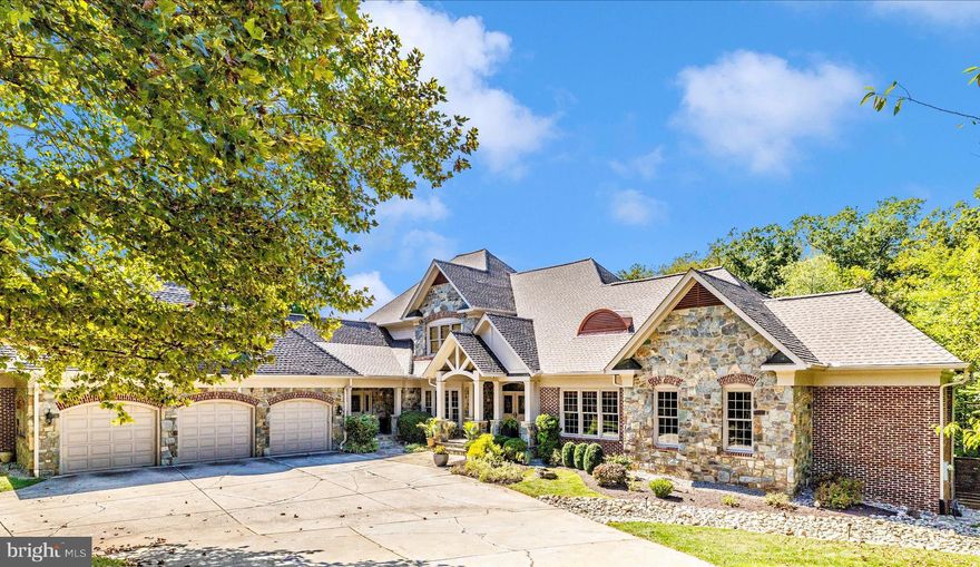 Welcome to this well maintained custom architectural masterpiece with over 9300 total finished square feet of resort-style living space and smart technology integration. From the moment you step inside, this custom-designed home delivers the WOW factor. 

Soaring ceilings, massive railroad trestle beams with iron brackets, and walls of glass create a dramatic open floor plan with panoramic views of the resort-style pool and private backyard retreat. Blending rustic warmth with cutting-edge features, the home has a brand-new roof with gutter leaf guards and a transferable lifetime labor warranty. 

It’s proudly recognized as Maryland’s first certified healthy home, featuring geothermal heating, a whole-house HEPA air filtration system, and a whole-house humidifier for year-round family health and comfort. Inside, the layout is as functional as it is breathtaking. 

The main level features 4 or 5 bedrooms and 3 full custom designed baths and one-half bath. A grand loft overlooks the great room and is a sanctuary itself with an additional half bath. An integrated Polk & Klipsch audio system with ceiling-mounted subwoofer delivers cathedral-like sound in both the kitchen and great room. 

The finished lower level includes 2 more bedrooms which can be used for family or Au Pair help with an additional 2 full professionally designed baths, a gym with exercise equipment (some of which conveys), and a media-ready rec room. 

The luxurious primary suite includes a spa-like bathroom with modern oversized tile and a heated tile floor. The dual home office spaces provide everyone with a quiet place to work comfortably and privately from home. There is also a elevator reaching all 3 levels. 

The chef’s kitchen is amazing and was designed by world-renowned architect Shorieh Talaat with entertainment on a grand scale in mind. It includes Wolf and Sub-Zero appliances, dual dishwashers, a smart microwave, a main, prep and coffee bar sink for a total of 3 separate sinks, making this a truly unique kitchen enhanced by sleek concrete countertops with ample prep space. This kitchen is capable of serving up to 50 guests. 

Step outside to your own private oasis; the centerpiece is a showstopping custom pool surrounded by 2,000+ sq ft of cool-to-the-touch porcelain tile (a $250,000 project) and 10-person hot tub. The professional landscaping with dramatic stone boulders and forest conservation easement behind the home affords total privacy. The built-in outdoor kitchen offers effortless space for entertainment, and the fully fenced backyard is designed for comfort and seclusion.  

Smart Home and efficiency features include: five-zone heating and cooling system with four smart thermostats, smart microwave, smart washer and dryer, whole-house intercom system, 360° smart security surveillance system, automatic natural gas-powered whole-house generator, garage doors with app-controlled access, and a garage refrigerator. 

This is a rare opportunity to own a home that combines architectural excellence, advanced smart-home technology, energy efficiency, and resort-style amenities—all in one unforgettable property.