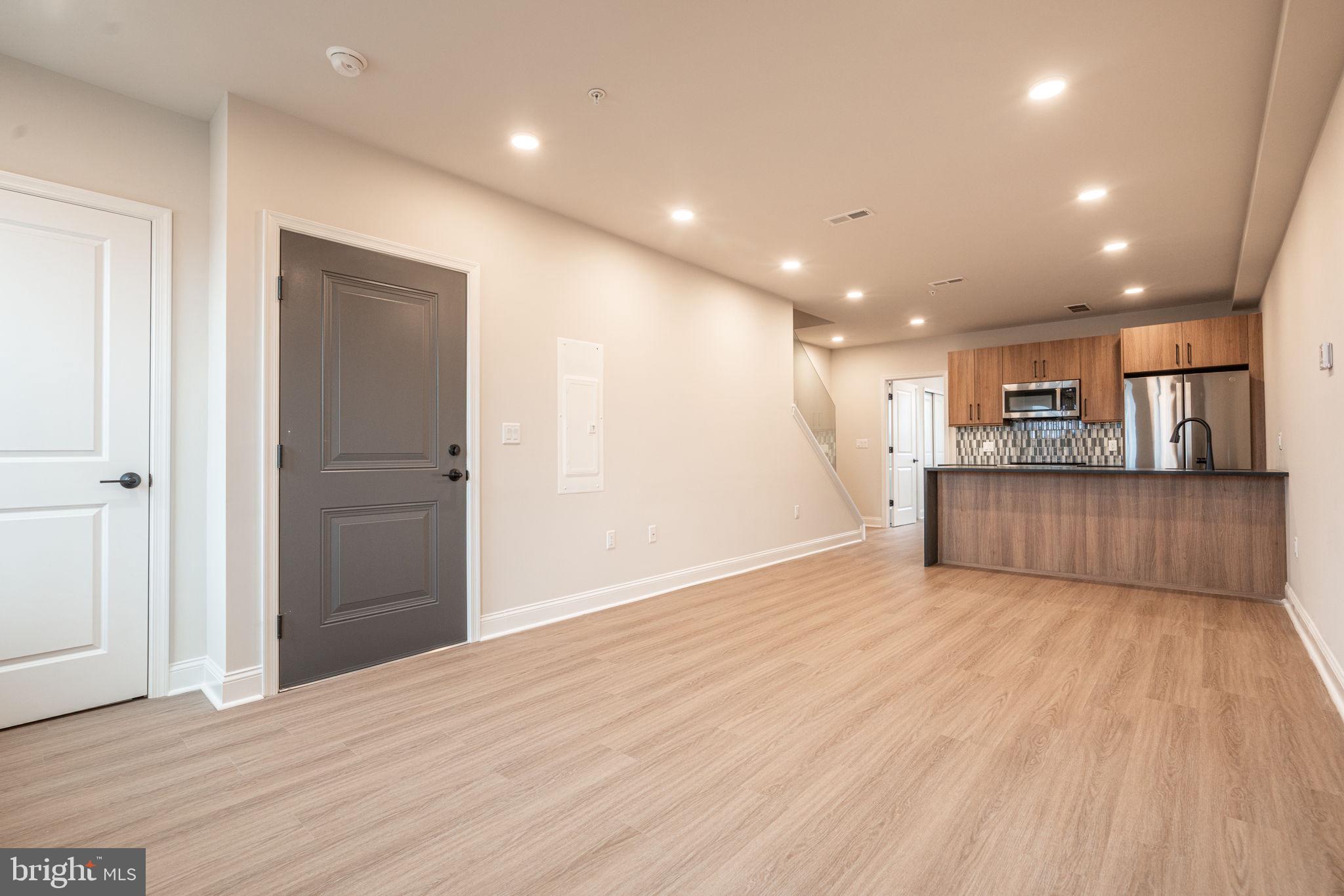 Welcome to your dream home nestled in the elite community of Wynnefield Heights Square, introducing a beautiful new construction condo at 4096 Conshohocken Avenue A2, Philadelphia PA. This chic residence boasts 3 spacious bedrooms and 2 modern bathrooms, all enveloped in the comfort of an energy-efficient HVAC system.
Step inside to find a meticulously crafted interior, featuring Quartz countertops that add an elegant touch to the sleek kitchen. Stainless steel appliances and high wall cabinets underscore the kitchen's modernity, while under-cabinet lighting brings warmth and functionality to your cooking space. The living areas boast beautiful white oak engineered flooring, creating a seamless flow throughout the home.
Natural light floods the space, highlighting the thoughtful details like wood baseboard molding and the cozy patio off the dining room - a serene spot for your morning coffee or evening relaxation. The chic exterior combines brick and vinyl siding, enhancing the building's charm and curb appeal. Awaiting approval, benefit from a 10-year tax abatement that promises affordability.
Assigned outdoor parking is available for $30,000, ensuring your vehicle's security just steps from your door for an additional fee. Embrace the future of living, available November , 2025. Your oasis in Wynnefield Heights Square awaits.