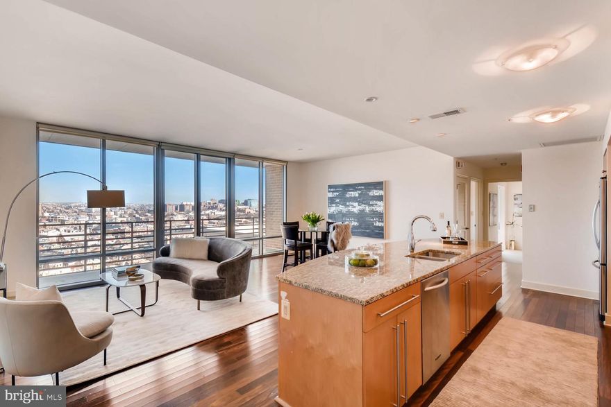 Stunning Harbor East corner residence at The Vue. This  two bedroom two  bath condo offers floor-to-ceiling windows with panoramic city and partial water views, gourmet kitchen with oversized island, rich hardwood flooring, private balcony, and 1 parking space. The Vue Condominium is located in Baltimore's most desirable neighborhood steps to the finest restaurants, boutique shops, Whole Foods, Starbucks, the Inner Harbor, waterfront and nightlife. Take the elevator to the MAC gym or the Harbor East Cinemas. Conveniently located to I-83.