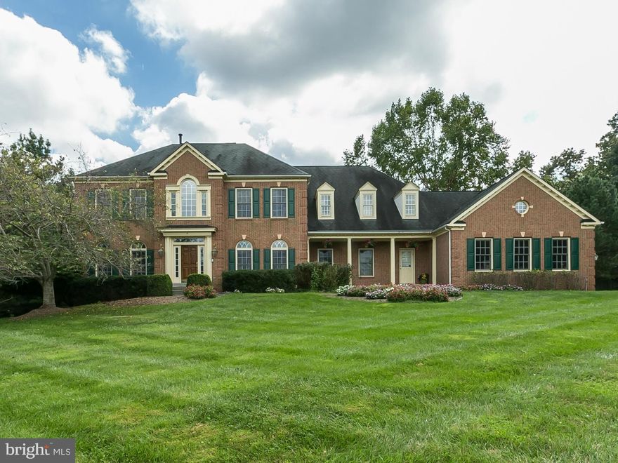 Impressive 4/5 BR 5.5BA Brick Colonial on a 1.47 acre beautifully landscaped lot with fabulous inground pool! Two story foyer welcomes you into this Bright home w/gracious room sizes and inviting gathering spaces. Newly updated kitchen w/granite cntrs & SS appl. HDWD floors, new carpet, Incredible MBR suite w/sitting room & huge walk-in closet, all BR's w/ensuite BA, Fully fin LLVL, 3 car gar!