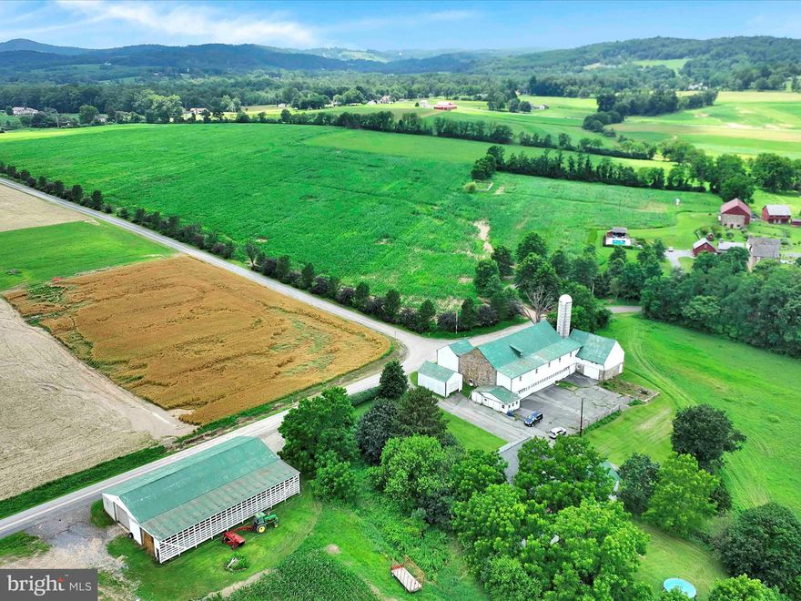 Nestled in the heart of the picturesque Oley Valley, this extraordinary legacy property spans over 100 rolling acres of rich, bucolic countryside. Offered for the first time in generations, this historic farm has been lovingly stewarded by a single family since the 1700s—a truly rare and remarkable opportunity to own a piece of Pennsylvania’s heritage.

The land itself is a breathtaking canvas of open fields, woodlands, and gentle hills, complete with a tranquil pond, creating an idyllic setting for agriculture, equestrian pursuits, or simply a peaceful retreat. At the center of the property stands a timeless and beautifully farmhouse, seamlessly blending historic charm with modern comforts. The character of the home has been preserved while incorporating tasteful upgrades for today’s living.

A large classic bank barn anchors the homestead, accompanied by multiple outbuildings that offer ample space for livestock, equipment, workshops, or creative use. The infrastructure and scale of this property offer tremendous versatility—ideal for farming, a family compound, or retreat.

This is more than just a farm—it’s a legacy. With its deep roots, unmatched setting, and boundless potential, this is a once-in-a-lifetime opportunity to write the next chapter in this storied property’s history. Don’t miss your chance to become a part of the enduring legacy of the Oley Valley.