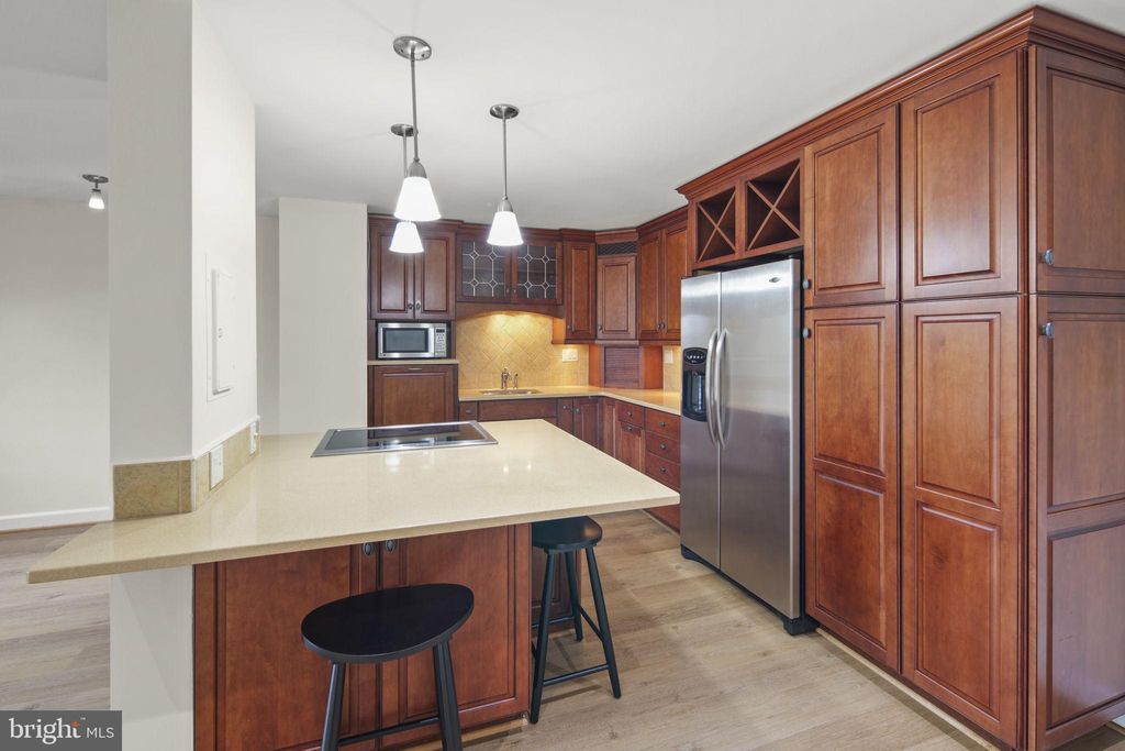 Photo of 8340 Greensboro Drive #302, MCLEAN, VA 22102 (MLS # VAFX2276440)