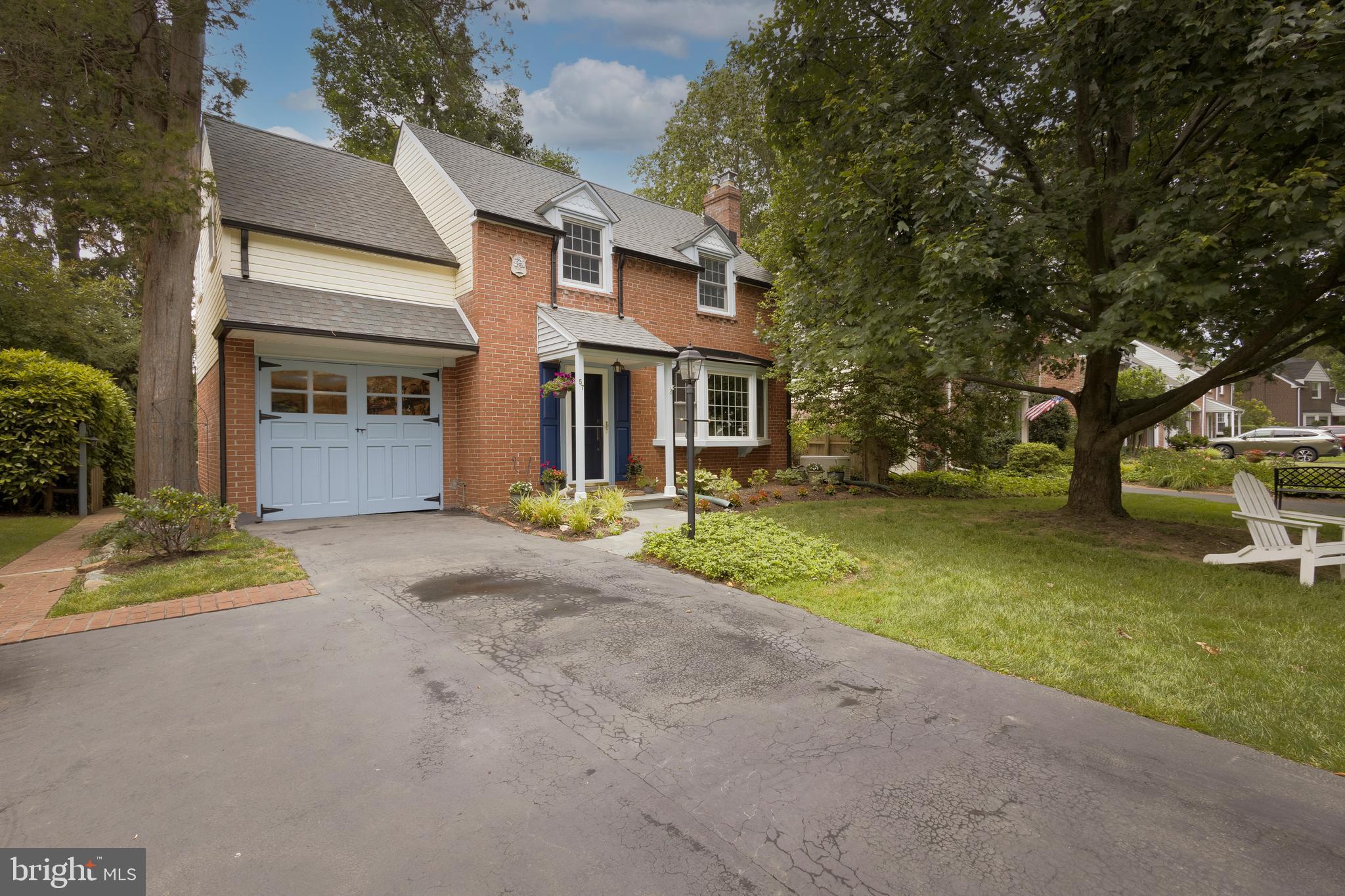 Charming is the perfect adjective to describe this home. Nestled on a beautifully landscaped lot, this four bedroom, two full bath home is surrounded by mature trees and lush plantings that create a serene and private retreat. A slate walkway leads to the welcoming front entrance while a brick patio in the fully fenced in backyard offers the perfect spot for outdoor entertaining. Inside you will find rich hardwood floors throughout adding warmth to every room. The hardwood in the kitchen, family room and staircase were refinished in 2019. The spacious living room offers a lovely wood burning fireplace with new glass doors (2024) while the formal dining room boasts chair rail and two corner built-ins, adding function and charm. The kitchen was updated in 2016 with granite countertops, wood cabinetry with under the cabinet lighting, and tile backsplash as well as rustic wood beams that continue into the expanded addition, currently being used as an eat in area and family room. The stainless-steel appliances have all been updated since 2022 and a new storm door was just recently installed in early June. Off the family room, you will find one of the full baths as well as an additional storage closet. A beautiful runner on the steps and through the hallway upstairs will lead you to four generous size bedrooms with ample closet space in each room. The 2nd level full bath was completely rebuilt from its studs in 2013 and a new pedestal sink was installed in 2017. The basement is separated into both a finished and unfinished space that contains all utilities and washer and dryer. Just a few of the upgrades are a new roof (2022), new hot water heater (2017), upgraded 200 amp electrical service and panel (2011) and new A/C installed in 2021. The home was converted from oil heat to gas heat in 2011 with a new heater installed at that time and a hard-wired full house Generac Generator was installed in 2018. All this and located in a highly sought after neighborhood within walking distance to North Hills Country Club and the North Hills Train Station as well as a quick drive to Lulu Country Club. Quick and easy access to all major routes of travel. With its classic architecture, thoughtful updates and beautiful surroundings, this home offers a perfect blend of tradition and comfort. Don't miss out on seeing this special home. Make an appointment today.