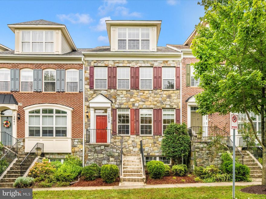 ***HUGE Price Improvement*** Welcome to this bright and spacious stone-front townhome offering over 2,700 sq. ft. of finished living space across four levels. With 5 bedrooms and 4.5 bathrooms, 2 car detached garage this home is thoughtfully designed for comfort, functionality, and modern living. This home has been thoughtfully upgraded for modern convenience and long-term comfort. New Roof (Oct 2025),Both the upper and lower levels are equipped with new energy-efficient HVAC systems (Aug 2025).  Additional recent updates include a new sump pump, all new smoke detectors  (Aug 2025), an upgraded gas stove, dishwasher, and microwave (2024), as well as smart front and back door locks for added security and ease, new carpet on stairs (May 2025). The main electrical panel has been enhanced with a 60-amp line, ready for an EV charger hookup.
Freshly painted throughout, the main level features hardwood flooring, a light-filled living and dining area, a well-appointed kitchen, and a convenient half bath — an ideal setup for both entertaining and everyday living. Upstairs, the expansive primary suite includes two walk-in closets and a spacious ensuite bath with dual vanities and a soaking tub. Two additional bedrooms on this level share an updated hallway bathroom with a sleek standing shower. The finished loft offers even more versatility with an additional bedroom, a walk-in closet, a cozy sitting area, and a fully updated bathroom with a walk-in shower. The lower level offers a spacious recreation room with a fireplace, another bedroom with a walk-in closet, and a full bathroom, providing the perfect setup for extended family or a separate living area.

Outside, enjoy additional private parking located behind the garage, along with a dedicated kids’ play area — a rare bonus in townhome communities. Enjoy all that Clarksburg Village has to offer, including two community pools, a clubhouse, walking trails, and beautifully maintained common areas. Ideally located near shopping, dining, parks, and major commuter routes, this move-in-ready home combines space, location, and upgrades that are hard to find. Schedule your tour today and experience everything this exceptional property has to offer!