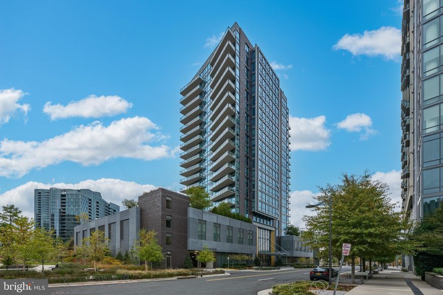 Experience unparalleled luxury at The Monarch, a premier building in the heart of Tysons. The Monarch offers an array of top-tier amenities, including 24/7 white-glove concierge service, a lobby attendant, an on-site full-time engineer, and property management for ultimate convenience. Guests can enjoy a dedicated Hospitality Suite, perfect for visiting family or overnight stays. Stay fit with the state-of-the-art fitness center and yoga studio, or relax by the outdoor swimming pool, heated for year-round enjoyment. The Monarch also features a social lounge, a rooftop dining room, and an outdoor grilling area designed for entertaining. This award-winning condominium has been recognized with the prestigious Delta Award for the Best Condominium in the DMV area.

Step into this remarkable 2-bedroom, 2-bathroom unit with sweeping city views from the balcony. Inside, the home boasts luxurious finishes, including 5" engineered hardwood floors, floor-to-ceiling windows with updated privacy solar shades, and sleek quartz countertops in both the kitchen and bathrooms. The kitchen is a chef's dream, featuring Italkraft cabinetry and top-of-the-line Miele appliances, complemented by 10'2" ceilings and Restoration Hardware upgraded light fixtures. The second bedroom is equipped with a custom Murphy bed and built-in shelving, maximizing space and flexibility.

The unit includes two large parking spaces conveniently located near the elevator, one of which is handicap accessible. Whether for everyday living or entertaining, this unit at The Monarch provides the ultimate in luxury and convenience.