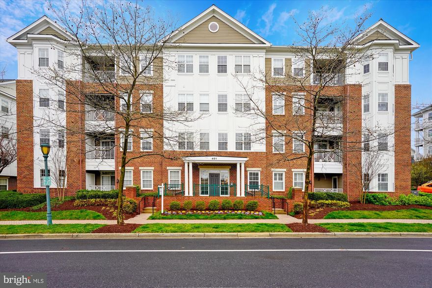 Welcome to 401 King Farm Boulevard, Unit 201, located in the award-winning community of King Farm. This stylish 2-bedroom, 2 and a half bathroom condo is perfect for those looking to blend comfort with modern living. Step inside to find elegant wood floors and chic crown moldings complemented by wainscoting accents throughout. The designated dining room seamlessly connects to a gourmet kitchen featuring stainless steel appliances, making it a delight for any home chef.

The living room opens up to a cozy balcony, inviting you to relax and enjoy the surrounding views. The primary bedroom is a true retreat, offering an ensuite bath complete with dual vanities, a jetted soaking tub, and a separate stall shower. The second bedroom includes a full bathroom as well. Convenience is key with an in-unit washer and dryer at your disposal.

Residents of this community enjoy an array of amenities, including pools, tennis and basketball courts, a well-equipped gym, and a security system for peace of mind. With an elevator for easy access and assigned parking, everyday living is made simple. You'll love the proximity to shopping, groceries, restaurants, and parks, while commuting is a breeze thanks to the excellent location.  TWO off-street assigned parking spaces behind the building are included.

Don't miss your chance to experience all that this exceptional home has to offer. Schedule your viewing today!