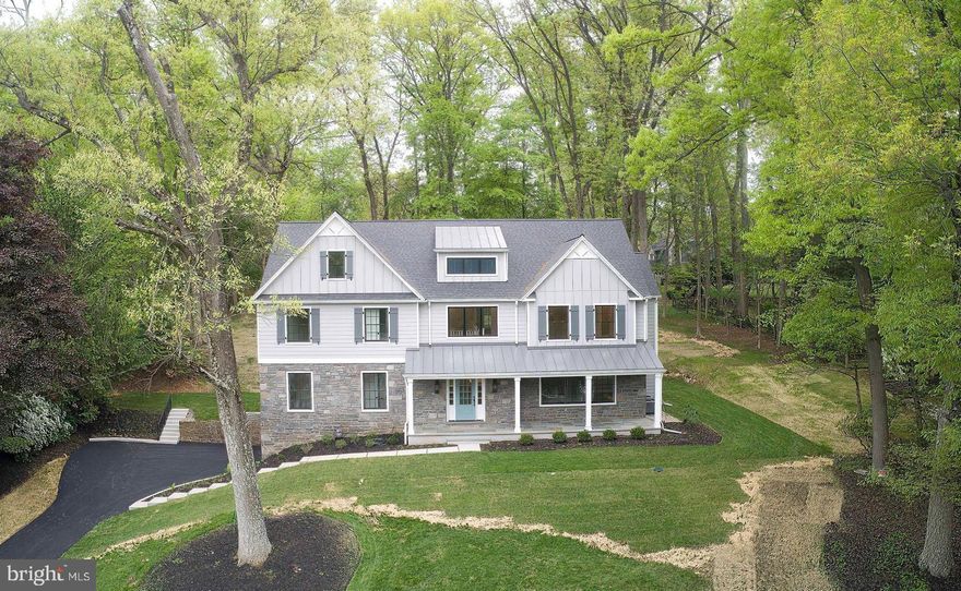 Exceptional quality and craftsmanship define this newly constructed showcase home by Sposato Homes in a highly desirable section of Wayne. Thoughtfully built using the existing foundation and exterior walls, this stone & Hardie plank faced residence offers five bedrooms, four full baths, and two half baths. The result is a refined layout with high end finishes that blends timeless architecture with modern functionality.
The main level features nine-foot ceilings, a private first floor study ideal for working from home, and a spacious family room with a coffered ceiling and fireplace that creates a warm and inviting gathering space.  Dining room with wainscoting & living room with decorated wall.  At the center of the home is a true chef’s kitchen designed for both everyday living and entertaining. It is equipped with premium Sub Zero and Wolf appliances, including a 36 inch six burner gas rangetop, professional double wall ovens, and a microwave drawer. Additional highlights include a Bosch dishwasher with advanced drying technology, custom hood ventilation, an undercounter beverage center, and a Sub Zero French door refrigerator with advanced air purification and LED lighting.
Interior finishes showcase attention to detail throughout, including white oak flooring, shaker style doors, wide baseboards, detailed wainscoting, and LED lighting. The second floor features a well-appointed primary suite with a tray ceiling, generous closet space, and a spa inspired bath designed for comfort and relaxation plus two bedrooms with ensuite bathrooms, two additional bedrooms and hall bathroom. A convenient second floor laundry area adds to the home’s functionality. Additional highlights include a walk-up attic offering excellent storage or future expansion potential, multiple flexible living spaces, and thoughtfully designed bathrooms throughout. The exterior is equally impressive with a slate front porch, standing seam metal roof, Pella windows, and a striking 12 light entry door with sidelights, all contributing to strong curb appeal. Ideally located near Trader Joe’s and Wegmans, with easy access to Valley Forge National Historical Park, the Paoli Thorndale Line, Route 76, Route 422, and the Pennsylvania Turnpike, this location offers exceptional convenience. Set within the highly regarded Tredyffrin Easttown School District, known for its strong academic reputation. A rare opportunity to own a newly constructed home that combines location, design, and craftsmanship in one of the Main Line’s most sought-after communities.
