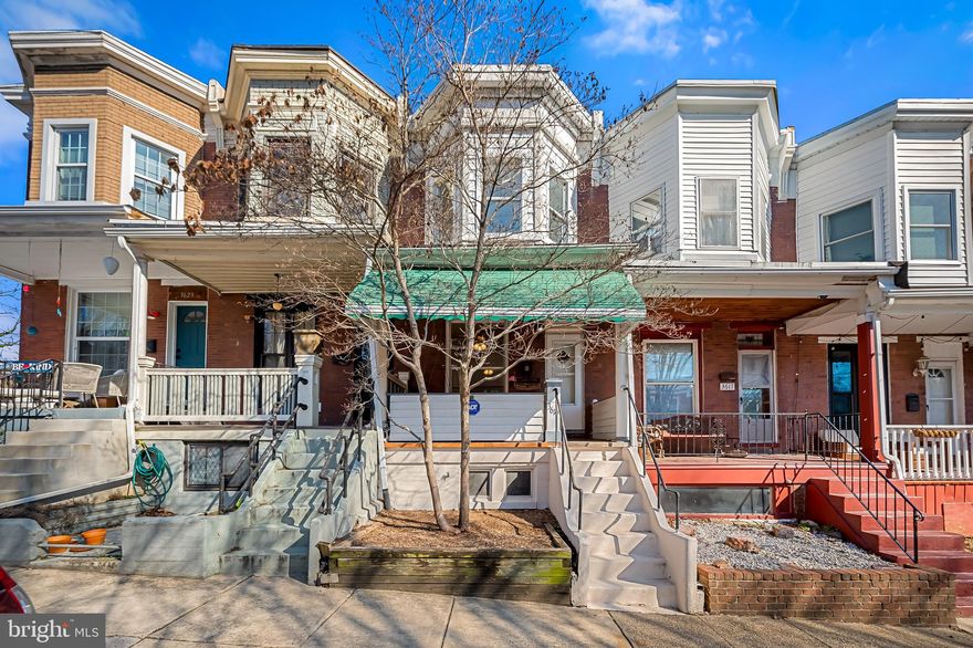 Well maintained 2 Bedroom, 1.5Bath townhouse in the Woodberry community with a 2 Car concrete parking pad! This cozy property features a first floor with ample sized windows, good natural light, hardwood floors, and a living room that opens to the dining room. As you make your way to the back of the property there is a spacious kitchen with a terracotta floor tile and an island. The kitchen has tons of cabinets and storage, a stainless steel dishwasher, a gas stove, and a refrigerator/freezer. Just off the kitchen you will find a tiled mudroom with access to the 1st floor powder and a convenient laundry room featuring Kenmore Elite washer and dryer. The mudroom also provides easy access to the spacious rear deck and concrete parking pad making for easy day to day living. On the second floor the home features an ample primary bedroom with nice closet space with built in shelving and storage racks. The second bedroom is well proportioned and has shared access to the hall bath. Between the two rooms there is a bonus space that could function as a home office, a play room, or a sitting room. The unfinished basement is spacious and provides ample storage and an area for a workshop.  Additionally, a New Bryant gas furnace was installed in February 2024. Take in the outdoors from either the comfort of the front porch or from the back deck. Both have awnings allowing for extended use throughout the seasons. Convenient access to all the local amenities; grocery stores, coffee shops, breweries, The Maryland Zoo, Druid Hill Park, restaurants, major routes of travel, and a short walk to Hampden. Come see what this home has to offer!