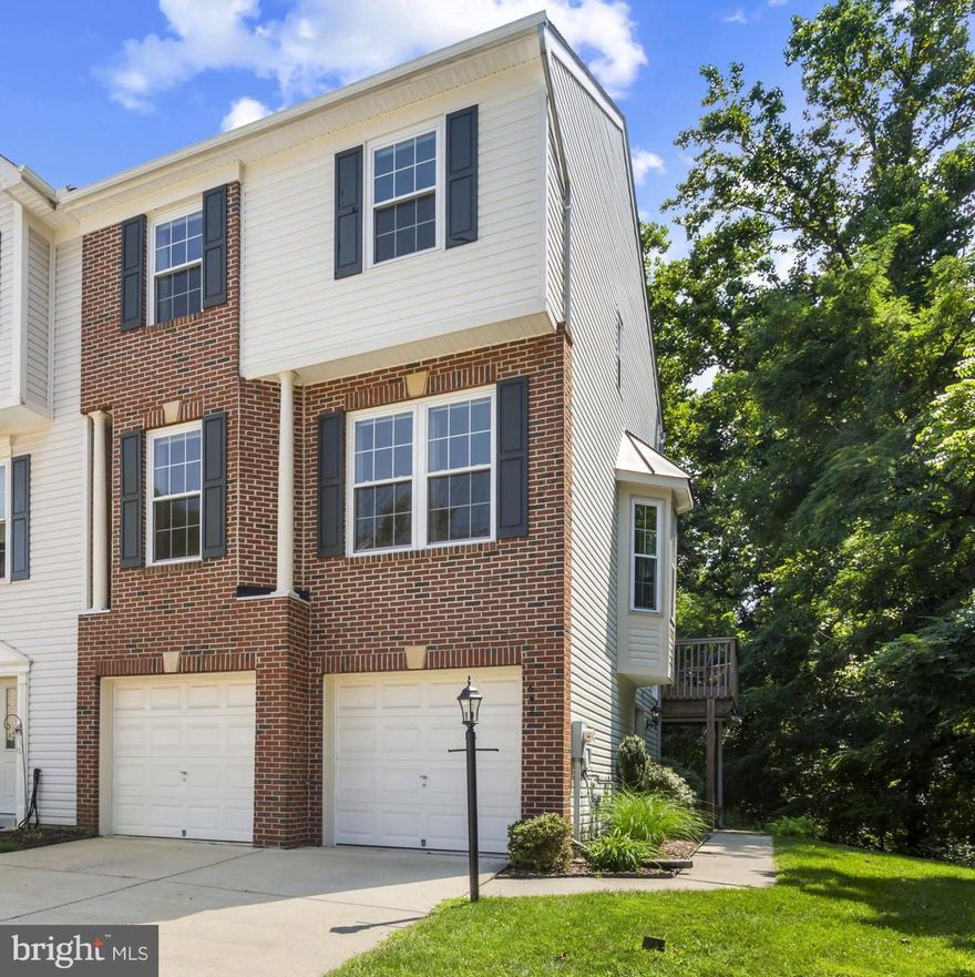 Welcome to this beautifully maintained and updated end-unit townhouse in the ideally situated Baystone community of Annapolis. Offering over 2,070 square feet of living space, this home combines timeless style, thoughtful upgrades, and a private setting backing to trees.

Move up to the light-filled, open-concept main level showcasing Brazilian cherry floors, 9-ft ceilings, and an inviting gas fireplace for year-round comfort. The modern kitchen features granite countertops, stainless steel appliances, and opens directly to a large, low-maintenance Ipe deck—ideal for entertaining or enjoying peaceful views. 

On the upper level, the primary suite offers dual walk-in closets and a fully renovated bath with elegant finishes. The second upstairs bath has also been completely renovated with beautiful marble tile for a luxurious, cohesive feel. The upper level includes three spacious bedrooms.

The lower level offers a flexible family or recreation room with access to the patio and garden. Just outside the lower-level walkout, a working water-feature pond adds a tranquil touch to the patio space. This home’s location is both peaceful and convenient—just steps from pedestrian paths along College Parkway, Broadneck Park, and Bay Hills Shopping Center. Recent improvements include a new roof in 2023, new carpeting on the upper level in July 2025, and a full interior repaint, also completed in July 2025. 

With a private-feeling end-unit position, fresh modern updates, sunlit interiors, and a perfect blend of indoor and outdoor spaces, 642 Baystone Court is move-in ready and offers the best of Annapolis living in one of the area’s most sought-after school districts.