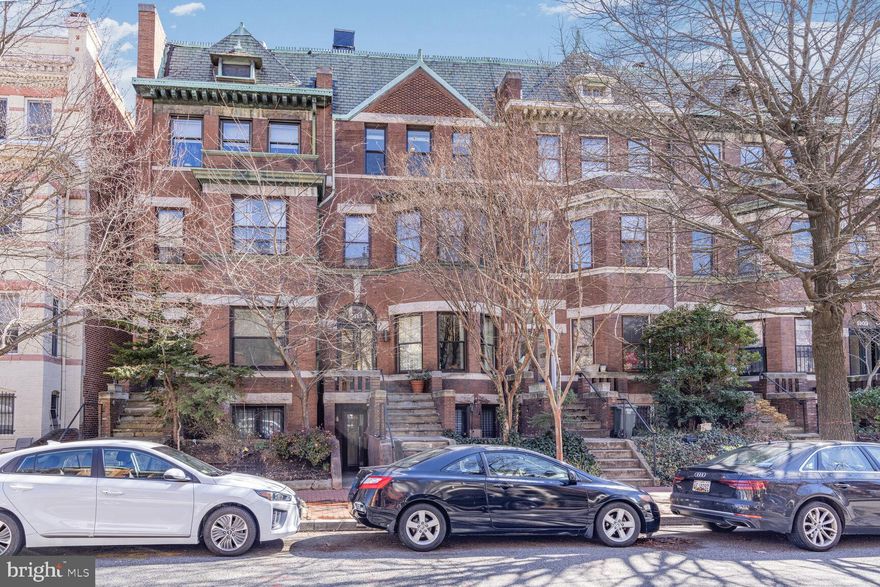 Sizzling, stylish and offering EVERY amenity in pristine, move-in condition, this spacious 1400sf two bedroom, two and a half bathroom duplex condominium is located the heart of Dupont Circle. High ceilings showcase the tall, built-in bookcases as well as the woodburning fireplace in the Living Room while abundant natural sunlight warms the entire Main Level. A window wall hall leads to the Powder Room and the Private Terrace where grilling and outdoor enjoyment are anticipated! The generous Dining Room gazes onto the Terrace and opens to a true “Chef’s dream kitchen” with long countertops, full sized luxury brand appliances and abundant cabinet space. Up the skylit stairway are two large bedrooms, each with beautifully renovated ensuite bathrooms and walk in closets, and a convenient laundry. Rental parking for one car is available directly behind the building. With low condominium fees, easy access to Metro, shopping and so many restaurants, this property will welcome you home!