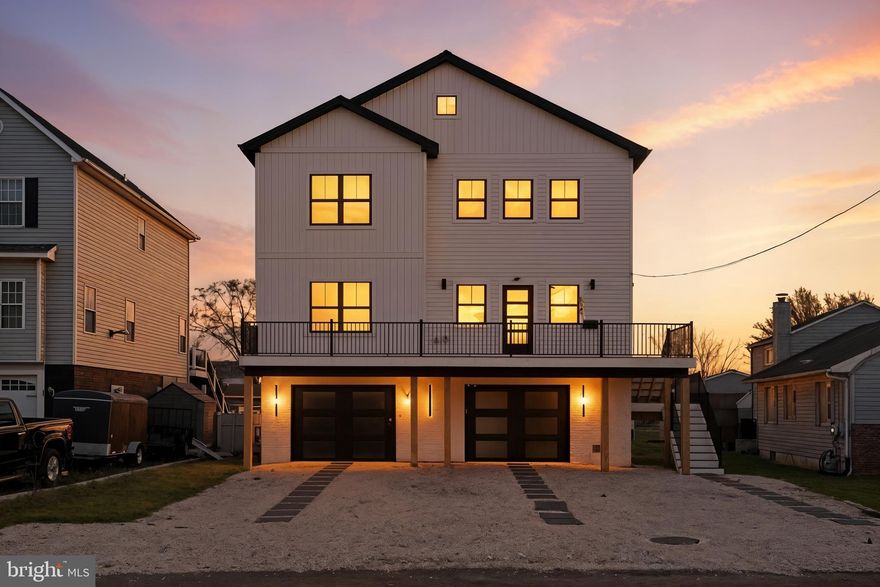 SELLER IS MOTIVATED AND IS REVIEWING ALL REASONABLE OFFERS**Experience Modern Coastal Living in Lynch Point - Welcome to your dream home in this coveted Lynch Point community of Sparrows Point, where coastal charm meets modern sophistication. Built in 2024, this nearly new construction showcases today’s design trends and energy-efficient systems, perfectly aligned with what discerning buyers are looking for today.
Sitting on a generous 0.37-acre lot, the property offers an ideal blend of indoor luxury and outdoor living. The home spans three levels of thoughtfully designed space. The **first level** features a spacious 1,500-square-foot multi-car garage and utility area ideal for whatever you choose.
The **main living level** unfolds in an airy, open-concept design encompassing the kitchen, dining, and living areas, large walk-in pantry—perfect for gatherings and everyday life. The chef-inspired kitchen features a custom floating ceiling, pot filler, and a dedicated dog shower, all accented by modern finishes that define current coastal-contemporary style. Two bedrooms and two-and-a-half baths complete this level, offering flexibility for guests or a home office. This home features surround sound and a deck on each level.
Upstairs, the **third level** is devoted to comfort and retreat.  A large loft, two bedrooms, including a spacious primary suite with 2 walk-in closets, are complemented by two full baths and access to another deck that invites natural light and the Chesapeake Bay breezes. Step outside to enjoy the large backyard overlooking the river. The detached rear garage adds versatility for extra storage or a creative workspace.
With Lynch Park and the waterfront just a short stroll away, this property captures the lifestyle today’s buyers crave: outdoor connection, modern convenience, and timeless design.
Additional highlights include 45-year architectural shingles, a tankless gas water heater, recessed lighting, surround sound, smart lights, and premium finishes throughout.
**Discover the perfect balance of craftsmanship, comfort, and contemporary coastal living! Schedule your private tour today.**