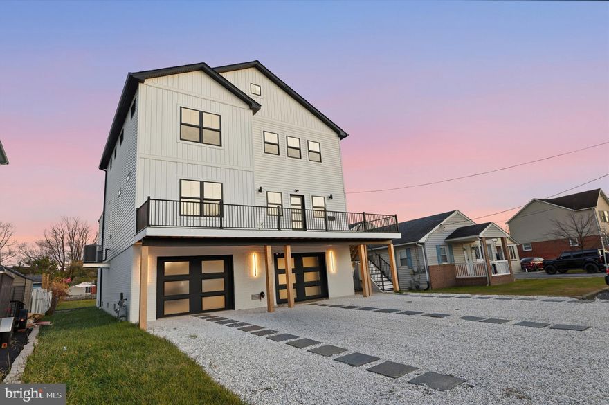 SELLER IS MOTIVATED AND IS REVIEWING ALL REASONABLE OFFERS**Experience Modern Coastal Living in Lynch Point - Welcome to your dream home in this coveted Lynch Point community of Sparrows Point, where coastal charm meets modern sophistication. Built in 2024, this nearly new construction showcases today’s design trends and energy-efficient systems, perfectly aligned with what discerning buyers are looking for today.
Sitting on a generous 0.37-acre lot, the property offers an ideal blend of indoor luxury and outdoor living. The home spans three levels of thoughtfully designed space. The **first level** features a spacious 1,500-square-foot multi-car garage and utility area ideal for whatever you choose.
The **main living level** unfolds in an airy, open-concept design encompassing the kitchen, dining, and living areas, large walk-in pantry—perfect for gatherings and everyday life. The chef-inspired kitchen features a custom floating ceiling, pot filler, and a dedicated dog shower, all accented by modern finishes that define current coastal-contemporary style. Two bedrooms and two-and-a-half baths complete this level, offering flexibility for guests or a home office. This home features surround sound and a deck on each level.
Upstairs, the **third level** is devoted to comfort and retreat.  A large loft, two bedrooms, including a spacious primary suite with 2 walk-in closets, are complemented by two full baths and access to another deck that invites natural light and the Chesapeake Bay breezes. Step outside to enjoy the large backyard overlooking the river. The detached rear garage adds versatility for extra storage or a creative workspace.
With Lynch Park and the waterfront just a short stroll away, this property captures the lifestyle today’s buyers crave: outdoor connection, modern convenience, and timeless design.
Additional highlights include 45-year architectural shingles, a tankless gas water heater, recessed lighting, surround sound, smart lights, and premium finishes throughout.
**Discover the perfect balance of craftsmanship, comfort, and contemporary coastal living! Schedule your private tour today.**