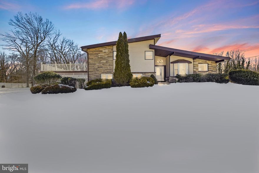 Welcome to a unique retreat where modern design meets a contempered  renovation. This property offers multi level structure with over 3,500 square feet of living space on a generous half acre lot, in addition to 500 plus square feet of a basement space , this architectural structure blends clean lines, warm textures, and light filled spaces in a way that feels both elevated and effortlessly homey.

 A covered front entrance welcomes you in and sets the tone for the thoughtful layout inside. Step into the foyer hallway and you find the beautifully updated kitchen to your right. Straight ahead, the home opens into a specious main living area featuring soaring cathedral ceilings, a dramatic brick corner fireplace, a formal dining room, and a sun drenched three season room wrapped in windows. New flooring throughout the home creates a seamless, modern look while still honoring the character that makes this style so iconic.

 The fully updated kitchen is a true showpiece, featuring stylish two tone cabinetry, quarts countertops, real oak hardwood floors, a stainless steel refrigerator, a sleek flat top cooktop, a dishwasher, and a wall oven with built-in microwave. A peninsula with seating for bar stools creates the perfect cozy spot for casual meals, morning coffee, or gathering with guests. A charming bay window brings in extra natural light, nice spot for reading a book. Kitchen door has direct access to backyard which makes indoor outdoor living and poolside entertaining effortless and convenient. The oversized walk in pantry keeps everything organized and out of sight.

 Upstairs, you will find four bedrooms and two full bathrooms, including a primary suite with private access to an expansive second story deck overlooking the side yard. Both full bathrooms have been completely updated and feature gorgeous wall tile that adds a luxurious, designer feel. No need to worry about storage here! Closet space is abundant throughout every floor of the home, giving you storage exactly where you need it.  

 The lower level expands your living options in a big way. With a fifth bedroom, a half bath, a spacious  laundry room with washer/dryer, and two additional flex spaces, this level can easily adapt to your lifestyle. It works beautifully as a private area for someone who wants more separation while living at home, perhaps a college age student or young adult, or as a comfortable space for additional multigenerational living. It could also function as a family room, home office, playroom, game room, or even a poolside lounge setup.  

 The unfinished basement adds even more value with substantial storage space and a dedicated workshop area for hobbies or projects.  

 Step outside and you will find your own backyard escape that has endless privacy going into the woods. fenced in inground pool is ready for summer gatherings, relaxing weekends, and making memories all season long. Additional patio space adjacent to the pool and right outside the three season room allows for a place for outdoor cooking, relaxing in a hammock, or watching over those enjoying their time poolside. A three car covered carport plus an oversized driveway provide generous parking for multiple vehicles and guests.  

 
With the benefit of five zone radiant natural gas heat, central air, public water and sewer and thoughtful updates throughout, this home offers you -- the future owner, to enjoy the home the best way possible.

Come and own it!