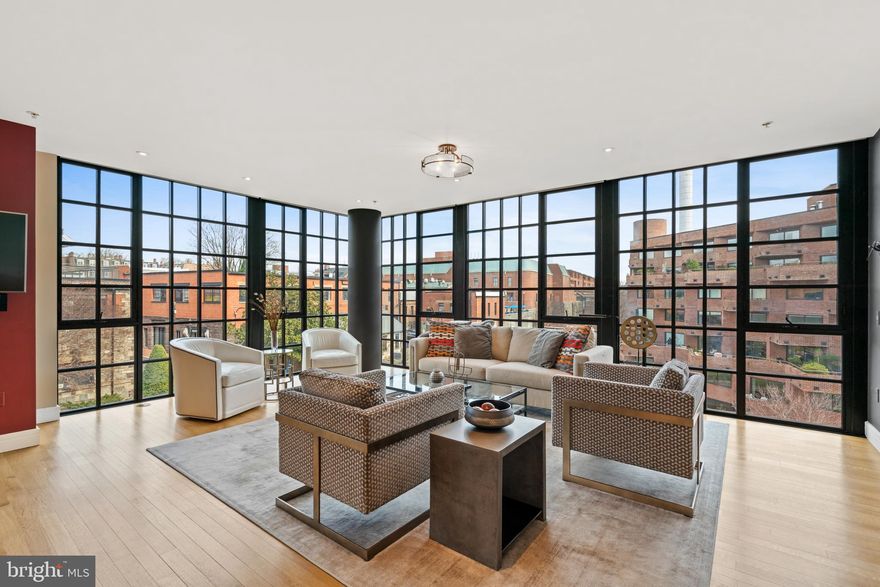 This beautiful residence is ideally located in one of the most sought-after Class A buildings in the heart of Georgetown. The unit features a wonderful open floor plan with floor-to-ceiling windows, which provide impressive views of the C&O Canal, historic Georgetown buildings, and open sky views while enjoying the peaceful and serene side Water St. The entry foyer provides gracious flow to the main living spaces, which are flooded by an abundance of natural sunlight. Directly off the foyer, an office area seamlessly adjoins the elegant living room. There is also a well-appointed renovated kitchen, which features marble countertops, high-end appliances, ample cabinet space, and a large peninsula with breakfast bar seating and wine storage. The kitchen opens to the dining room, which directly accesses a quaint balcony overlooking the canal. There is also the added convenience of a powder room nearby. A private hallway leads to the bedroom accommodations. The hallway is lined with double coat closets and a large closet with a hidden stacked washer/dryer and additional space for storage needs. The luxurious primary suite is generously proportioned and offers floor to ceiling windows, a charming private balcony, walk-in closet with built-in shelving, and an additional secondary closet. There is a spa-inspired en-suite marble bathroom with dual vanities, a frameless glass shower, and a separate soaking tub. The second bedroom also has floor to ceiling windows, a balcony, and a private en-suite marble bathroom. The residence has two garage parking spaces and two additional storage units. This full-service building has amenities including a 24-hour front desk, on-site management, gym, rooftop terrace, and pool. It is within close proximity to world-class shopping, restaurants, parks, The Kennedy Center, and Reagan National Airport.