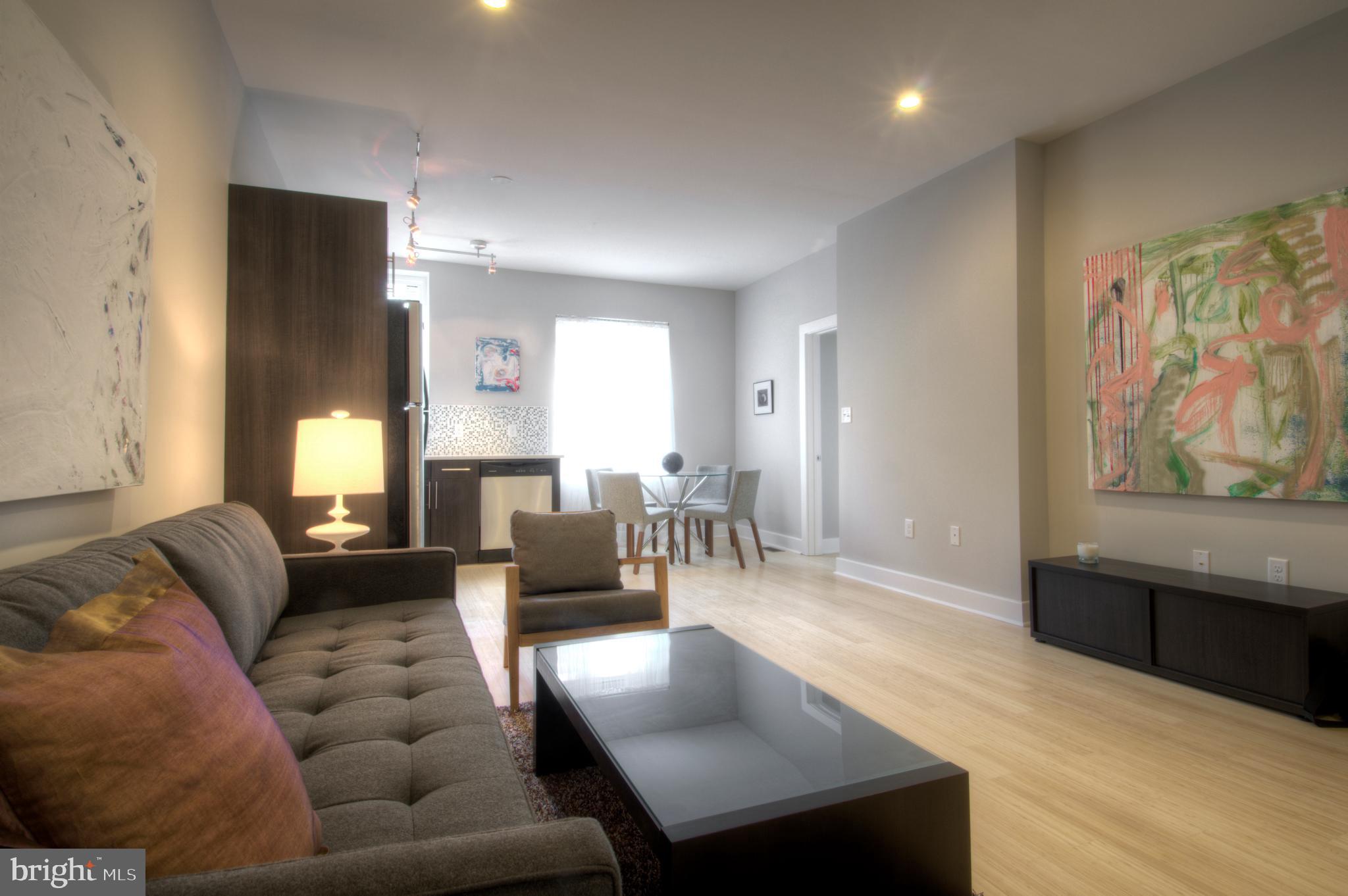 Beautiful open layout. This unit has a gourmet kitchen with stainless steel appliances, white Silestone countertops, flat-panel espresso custom cabinetry. hardwood floors, porcelain tile bathroom with a seamless glass shower! Each unit has its own washer/dryer and the building has a beautifully landscaped outdoor courtyard. Pet friendly!
