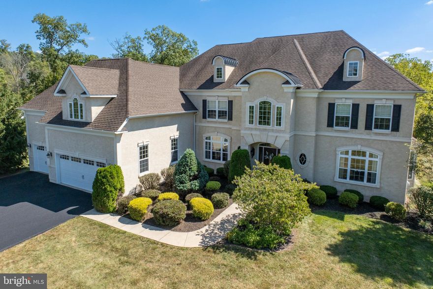 Be Sure to see the Video of this Amazing Home!     BY APPOINTMENT ONLY!
Welcome to 1350 Rupert Rd, an Opulant Dream Home, exceeding 6000 SQ. FT. boasting numerous enhancements within the Esteemed Golfview at Ravens Claw Community, where Sophistication, Relaxation and Comfort harmoniously blend. The Property spans 1.33 acres, including a partial wooded area that provides privacy. 
Prepare to be captivated as you enter through the front door, greeted by an impressive two story foyer featuring dual butterfly grand wrought iron staircases. Your gaze will drawn from the grand entrance through twin columns and a stunning balcony to the family room, which includes a beautiful gas fireplace and a wall of windows that flood the space with natural light.
This Extraordinary home features an Owners Suite, complete with a Luxurious Bath retreat area, Dressing area, and two spacious walk-in closets, along with a Coffee bar, built in refridgerator drawers, a second elegant gas fireplace and a Tray Ceiling. The upper floor also hosts three additional bedrooms, each with its own Private bath, surrounding an open hallway that overlooks both the family room and the magnificent two story foyer.
The main level boasts 9 foot Ceilings and tray Ceilings in both the Formal Living and Dining rooms. This floor includes a Gourmet Kitchen equipped with upgraded Cabinetry, Granite Countertops, Stainless steel GE Monogram appliances, featuring a Double Convection Oven, Microwave, Dishwasher,Oversized Refrigerator, and a gas five burner cooktop. The Expansive Angled Island is complimented by a Warming Drawer and a Mini Refrigerator .The Kitchen also offers a large walk-in Pantry and provides access to the main floor Trex Deck through a French Door with a Transom Window. The private Study/Office featuring glass doors, connects to the living room via a mini Wet Bar with upgraded Cabinetry and a mini refrigerator, and both rooms are enhanced by bump-out windows that increase natural light. The Family room on this level serves as an ideal retreat for enjoying the Fireplace, Reading, Unwinding with a movie or hosting gatherings with loved ones! This space is enhanced by dual ceiling fans, a staircase leading to the upper floor, a Balcony view that contributes to its bright and airy ambiance. The Main floor is further complimented by a half bath, a Mudroom, and a Laundry area equipped with upgraded cabinetry and a deep sink, and provides access to the three car garage. 
The finished lower level stands out as another remarkable feature of this exquisite home. It also boasts nine foot ceilings and large windows that flood the area with natural light, along with a Sliding Glass Door that opens to a hardscaped Patio. This expansive and adaptable living space includes one and a half baths, a Custom Bar a Kitchenette complete with essential Appliances( stove, microwave, dishwasher, and refrigerator) a gas hook-up for a third fireplace, and two storage areas, offering limitless possibilities for use.
Additional Noteworthy attributes of this residence comprise of Hardwood Flooring, and new wall to wall carpeting in various rooms, an Alarm System, Central Vacuum System on the Main and Upper levels, and an invisible Dog Fence . 
Experience the Benefits of living in a Golf Community with-out an HOA, or Fees associated with them. 
Conveniently located just off the Sanatoga exit of rt 422, and just minutes from the Philadelphia Premium Outlets, and a short drive to the King of Prussia Mall! 
Listing Agent Will Attend Showings to answer Any Questions!