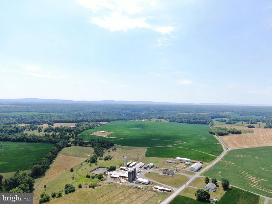 OUTSTANDING 191± ACRE WASHINGTON COUNTY, MD FARM! The Wiles Farm will be offered for sale for the first time in over 50 years. Charlie and Martha Wiles were very active in the dairy and embryo transfer industries for many years. The farm features 191.91± acres with 141± acres tillable with large, flat, open fields. The farm features a 5 bedroom 3 bath brick rancher and a 14x72 3 bed 2 bath mobile home. 
The farm buildings include: 44x70 bank barn w/ roof and barn having been just painted, 60x132 free stall barn w/ approx. 120 free stalls, 17x53 75 cow holding area, 17x35 double six milking parlor (no equipment), 17x37 milk house (no equipment), 8x17 storage room, 17x54 hay overhang shed, approx. 50x75x 6 foot tall dry manure storage area, 800,000 gallon lagoon, 40x120 equipment shed, 16x96 bull barn, 40x120 commodities/ dry cow shed, 18x80 box stall shed, center feed bunk w/ 10x96 overhang, 32x55 and 12x24 horse barns, 8x80 calf barn, 10x30 office, 16x72 Sollenberger silo, 22x50 silo, and (2) 20x50 silos w/ one of them having a recently rebuilt Big Jim unloader with new elevator, conveyor chain, and auger which has only unloaded one silo. Also featured on the farm is 20± acres of fenced pasture along with 18 energy free waterers.
7.5± Acres of the farm are enrolled in the CREP program and will be for the next 14 years. The farm is enrolled in the Maryland Agricultural Land Preservation Program. 
This property will be offered at auction on Friday November 15, 2024 @ 1pm. The List price in no way represents a minimum, starting, or acceptable bid.