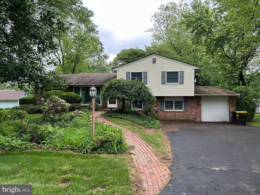 Build some sweat equity in this spacious 3-4 bedroom split level single home on almost a half acre in the Award Winning North Penn School District. The generous size living room boasts high baseboards, crown molding , and a large bay window that overlooks the front yard. Stroll into the dining room with a window sill bench with inside storage, high baseboards, and crown molding. The eat-in kitchen offers 42" cabinetry, tile backsplash, upgraded countertops, recessed lighting, and hardwood flooring. The large separate family room can also be utilized as a 4th bedroom for someone who doesn't want to do steps. The room offers built in bookshelves and cabinetry, ceiling fan, and closet space. Just up a small set of stairs are 3 nice size bedrooms and a full hall bathroom with large skylight. Proceed down to the finished lower level with a pellet stove that can heat the entire home, a separate utility room that offers storage space, a laundry room with cabinetry and utility sink, and a powder room. From the lower level you can go right into the oversized 1 car garage with electric garage door opener and a separate workshop area that sits behind the garage. Everyone in the pool! Out to the fully fenced in backyard with spacious wood deck with gazebo, large brick patio, a heated in ground pool with pool house to store your pool supplies and changing area. The rest of the backyard offers plenty of space for little ones to play or for a person who like to do gardening. Other amenities this home offers is central air conditioning, natural gas heat, and a driveway big enough for 6 car parking. Conveniently located down the street from ball fields and lots of nearby shops and restaurants.  With some TLC, this property can transform into the home of your dreams!