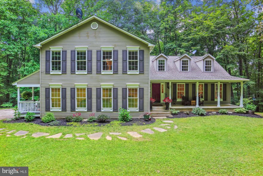 This home was custom built and sits on 9 acres surrounded by beautiful majestic trees. Special features are a gourmet kitchen complete with a Thermador six burner cooktop with accessories and exhaust hood, convention double oven, 34 inch high granite counter tops, kitchen aide refrigerator, Asko dishwasher, oversized deep sink, touchless faucet, soap dispenser, touch disposer, and custom pull out drawers. Built in microwave is a combo microbe, convention and steam combination. All appliances are integrated in the cabinets as well as the trash cans.  Living room or dining room has recessed lighting, Family room off the kitchen with wood burning fireplace and blower. Both kitchen and family room have access to the two tiered Trex deck overlooking majestic trees. Guest full bath with 2 piece crown molding, chair rail and bead board. Laundry room with washer and dryer with plenty of room to customize. In law suite with separate entrance and porch, walk in closet, and full bath with heat lamp.
Upper level boast a primary suite with a custom primary full bath, double sinks on 34 inch comfort height counter tops, custom cabinet, double shower heads, toilet closet, porcelain heated floors and lights controls are Wi-Fi compatible. Primary suite includes a bonus room (home office) and walk-in dressing area with custom clothing closets and drawers. Three additional bedrooms with a full hall bath with marble floors and large linen closet. Full walkout basement with wood stove and workshop.  Thermostats are all smart thermostats. Special exterior features include under-deck gutter system, front and side porches, large shed, and cabin with electricity, bedroom, and kitchenette. Enjoy the firepit on cool nights on the side of the house. There is a stream and spring on the property. The home is surrounded by seasonal mountain views, and located near the Appalachian trail, Washington Monument State Park, Greenbriar and Gambrills State Parks.