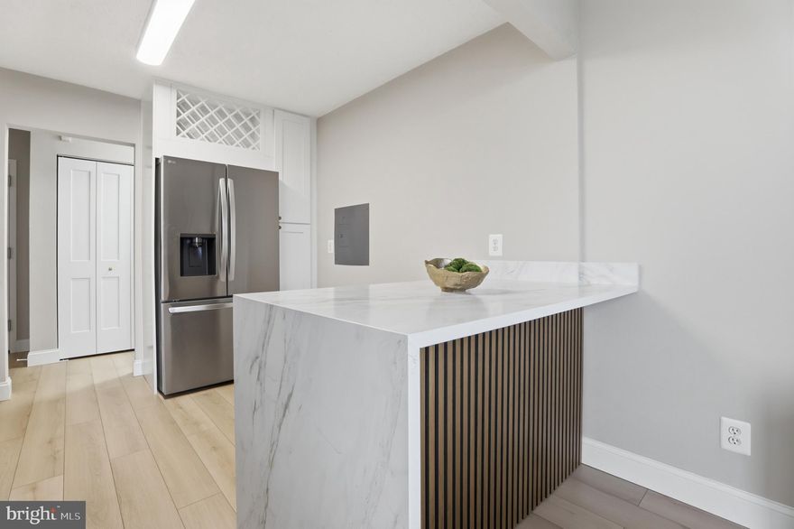 Welcome to Votre Maison!

This stunning condominium has been completely reimagined by Renowned Northern Virginia builder, blending luxurious French-inspired accents with top-tier modern upgrades. From the moment you step inside, you'll notice the impeccable attention to detail: brand-new 7-inch luxury vinyl plank flooring throughout, fresh paint, new molding, new doors, new air vents, and a sleek new thermostat. The spacious living area opens to a large SOUTH-FACING balcony—ideal for soaking up natural light and perfect for feng shui design enthusiasts. Floor-to-ceiling windows and a sliding door flood the home with sunshine, creating a warm and inviting atmosphere.

The chef’s dream kitchen is a showstopper, featuring a stunning quartz island with waterfall edges and a chestnut wood acoustic panel that doubles as a desk or extra seating space for gatherings. You'll find all-new LG ® appliances, including a stove, microwave, refrigerator with water filter, dishwasher, and wine rack. The new cabinets, hardware, light fixtures, and sink with a modern faucet and soap dispenser complete this culinary haven.

Down the hallway, you'll find a brand-new washer and dryer, leading to a fully renovated spa-like bathroom that offers a true retreat. The generously sized bedroom is designed for comfort and can easily accommodate a king-sized bed.

This move-in-ready condominium also comes with an impressive list of amenities: a swimming pool, fitness center, tennis courts, party room, and much more. The $829.10 monthly condo fee includes water, electricity, and gas, and residents enjoy the convenience of a parking decal, additional storage (A- 531), and a secured FOB entry system with 24/7 concierge service for peace of mind.

Centrally located, this property offers unbeatable access to the best of Northern Virginia and the D.C. metro area. It's just 10 minutes from the West Falls Church Metro Station, 5 minutes to Trader Joe’s, and 4 minutes to Starbucks, with nearby EV charging stations and countless dining and shopping options, including Tysons, Mosaic District, and Arlington.

This condominium isn't just a home—it’s a lifestyle upgrade waiting for you!