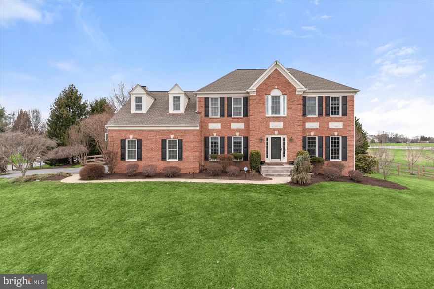 Welcome to 7111 Brookshire Lane in the sought-after Ashleigh Knolls community of Clarksville. Built by Winchester Homes and set on a picturesque 0.91-acre lot, this beautifully updated transitional colonial offers 4 bedrooms, 3 full and 1 half baths, and a fully finished basement designed for both everyday living and exceptional entertaining.
Extensively upgraded between 2020 and 2025, the home features new wood flooring and carpet (2025), new blinds (2023), updated stair pickets and door hardware, plus major system updates including a heat pump and water heater (2023).
The renovated kitchen serves as the heart of the home with refaced cabinetry, quartz countertops, stainless steel appliances, drawer microwave, trash compactor, stylish backsplash, pendant lighting, under-island lighting, and wood flooring. A custom storage bench and pantry organizer system with wine fridge (2025) add both beauty and functionality.
The family room showcases custom trim and molding, in-wall Sonos speakers with subwoofers and amplifier, and a dramatic stacked-stone fireplace surround with new gas fireplace and logs (2025). A well-designed laundry and mudroom includes an LG washer and dryer and a convenient drop-station organizer.
The fully finished lower level offers outstanding versatility with a full bath (2022), kitchenette with stainless sink, Murphy bed, gym flooring, waterproof flooring, and a dedicated home theater featuring a 110-inch screen, full surround sound, eight recliners, in-wall speakers, wall sconces, and non-reflective theater paint.
Upstairs, the spacious primary suite features a newly designed walk-in closet organizer and an upgraded primary bath with walk-in shower and double vanity. The hall bath was fully remodeled with a pocket door.
Outdoor living is truly exceptional with a StruXures pergola featuring lighting, fan, and power closure, a terrazzo patio with striking vertical fireplace, stone garden walls with lighting, and illuminated stair treads. The outdoor kitchen includes water and electric service, Lynx gas grill, full-size Lynx ice maker, kegerator, and dedicated gas cooking. Sonance/Sonos wired speakers provide seamless outdoor entertainment.
Additional highlights include Window Nation windows and new shutters (2023), fencing by Fences by Doug, a shed with lofts by Lapp Structures, Rainbow playground equipment, professional landscaping with uplighting, an American Eagle in-ground basketball hoop, vinyl-clad trash enclosure, and a Tesla charging station in the side-load two-car garage.
A rare opportunity to own a thoughtfully upgraded home with exceptional indoor and outdoor living in one of Clarksville’s most desirable communities.