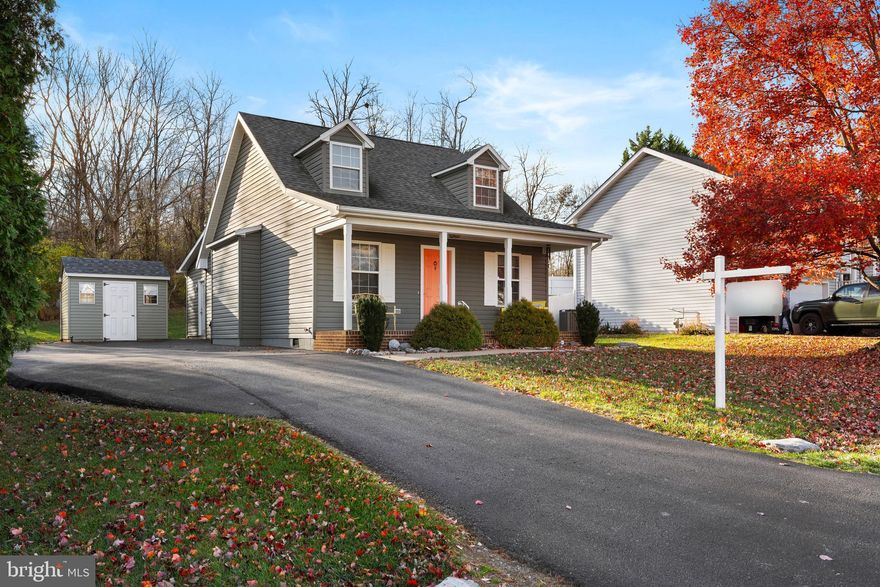 Welcome to 605 Artisan Way in Martinsburg, WV! This charming Cape Cod offers 3 bedrooms, 2 full baths, and over 1,500 total finished square feet. The home has been exceptionally maintained with major updates for peace of mind, including a furnace and central A/C replaced in 2020 (approx. 2020), roof and siding replaced in 2018 (approx. 2018), a whole-house filter and water softener added in 2025 (approx. 2025), new washer/dryer in 2024 (approx. 2024), new dishwasher in 2018 (approx. 2018), and a new water heater in 2023 (approx. 2023). Inside, you’ll find a bright family room with vaulted ceilings, LVP flooring, and abundant natural light, flowing into an open kitchen, dining area, and a gorgeous 10’ x 14’ sunroom addition built in 2019 (approx. 2019). The sunroom opens to a private backyard with a concrete pad and hot tub. The main level features two spacious bedrooms with LVP flooring and ceiling fans, plus a full bath, while the upper level offers a large primary suite with ample closet space and a tiled walk-in shower. Additional highlights include an expanded driveway that fits six or more vehicles and a detached shed with matching siding for extra storage. Located in Dry Run Commons just off Rock Cliff Dr., you’re minutes from shopping, dining, entertainment, commuter routes, War Memorial Park, the community pool, and the Amtrak station.