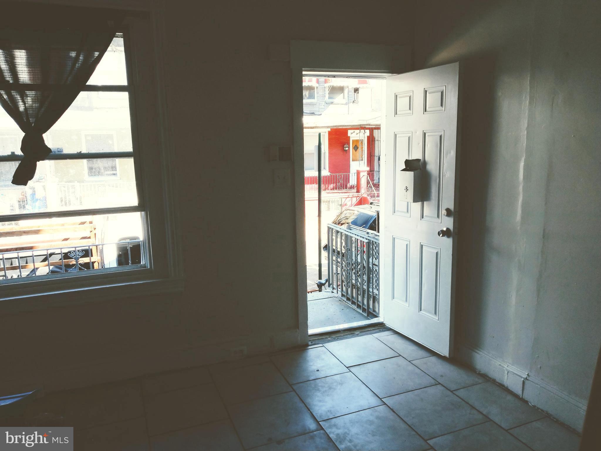 Step into this charming townhome offering a blend of character and opportunity. Inside, you'll find three bedrooms, one full bathroom, and approximately 980 square feet of living space. The layout features bright, naturally lit rooms with large windows, tiled flooring, and a classic staircase with vintage railing details that add historic charm. The property showcases original woodwork and trim throughout, giving it a warm, traditional feel. Your basement offers additional storage or flex space to suit your needs. The front living area is spacious and boasts a bay window that provides natural light. Located in North Philadelphia, the home is surrounded by murals, neighborhood eateries, and convenient public transit access. Whether you're a first-time buyer, investor, or someone looking to renovate and customize, this property offers great value with long-term potential. With its solid structure, accessible location, and classic appeal, this home is ready for its next chapter. The property is currently tenant occupied on a month to month lease at $824.00 / month.