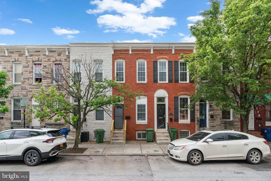 Welcome to your newly renovated townhome in the heart of the city! Step inside to discover an open-concept layout with stunning new LVP flooring throughout and a stylish brick accent wall that adds a touch of city charm. The beautifully updated kitchen features new appliances, sleek cabinetry, and a beautiful backsplash—perfect for both everyday living and entertaining. Each bathroom has been tastefully renovated with modern finishes. The basement offers flexible space for an extra bedroom, home office, gym, or additional storage. Enjoy the outdoors in your private, fenced-in yard. Located just steps from the stadiums and all the best dining, shopping, and entertainment the city has to offer—this home is perfect for city living! Experience the best of city living with comfort and style!