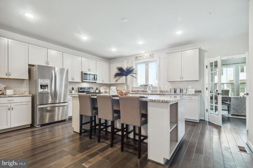 Rarely available 3 Bedroom 4 Bathroom townhome with 4th level living space in Laurel Maryland's finest Watershed Community. This home offers a 6FT extension on four levels that further expands the open layout of the Owner's Suite, Main Floor, and also the Basement. Featuring room sizes that are comparable to a single-family home, this townhome has it all: Office/Den, Owner's Suite with 2 walk-in-closets and an En-suite luxury bath with spa shower, double vanity and water closet, Upper Level Laundry, Basement with Theater Room set-up, and a 2-Car Garage. In addition, the home offers two outdoor living areas, one on the main floor and the second is on the 4th level, both are great for entertaining. The state of the art Kitchen includes a 5-burner gas range, convection oven, oversized island with storage, farm sink, pantry, and lots of cabinets for storage. Excellent condition throughout.

The community amenities include: Fitness Center, Outdoor Pool, Clubhouse, Bike Pump Track, Community Garden, Fire Pit, Grills, and Walking Trails. More amenities will be added soon.

Short distance to Ft Meade/Baltimore/ Washington, D.C. commutes. Also within the highly rated and award winning Maryland City Elementary School district.