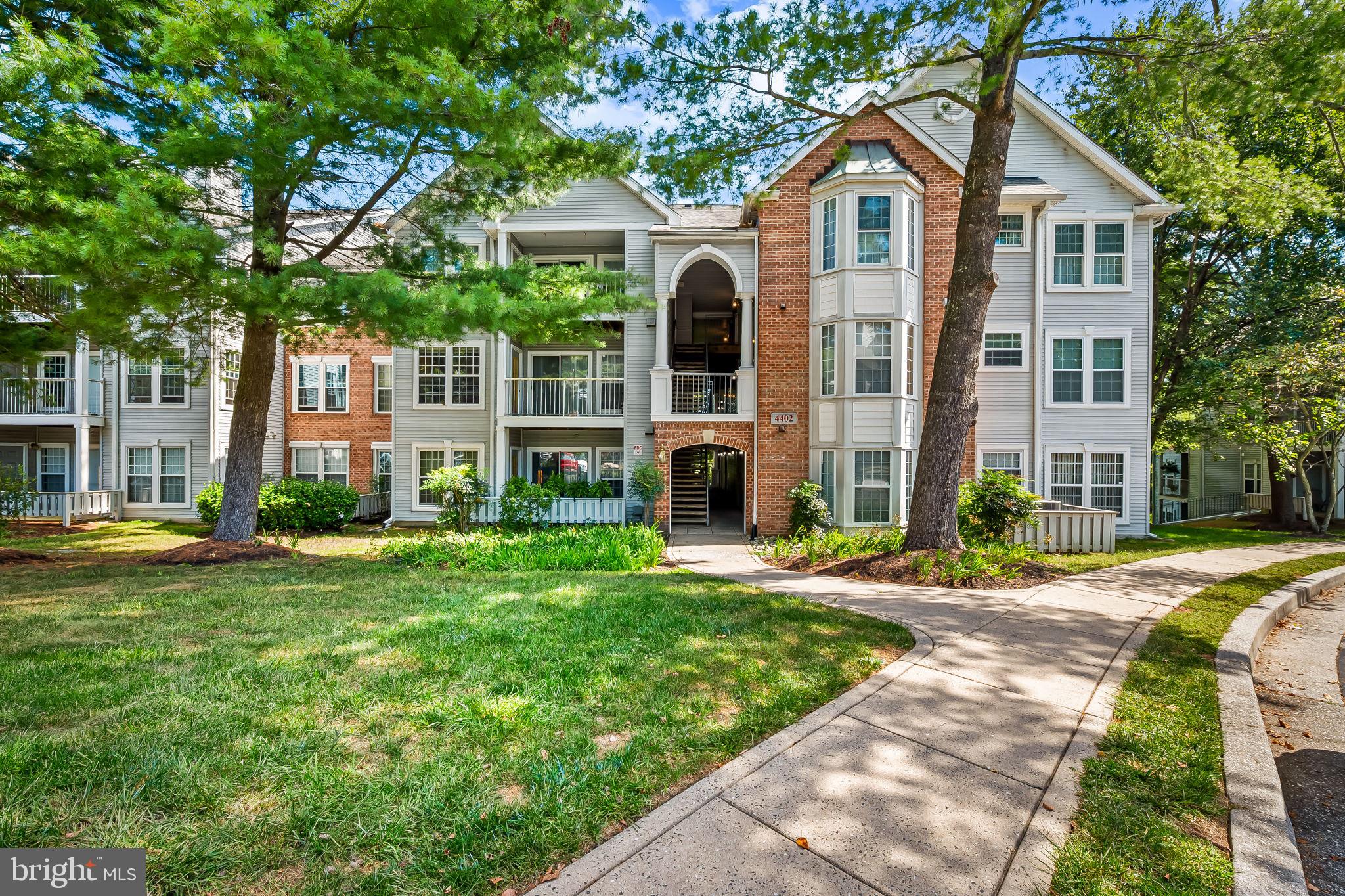 Welcome to your move-in ready retreat at 4402 Silverbrook Lane, Unit D103 in Owings Mills, MD! This spacious condo offers tons of comfort and style. Step inside to find fresh paint and brand new wide plank flooring throughout, setting a modern tone for easy living. The many windows with new blinds, offer an abundance of natural light. Enjoy the cozy ambiance of a wood burning fireplace, perfect for relaxing evenings. Step out onto the deck and immerse yourself in the tranquility of surrounding trees—a true escape into nature. The home features 2 bedrooms & 2 bathrooms, enhancing convenience for you and your guests. This unit is located in the vibrant New Town community, known for its superb amenities. Dive into relaxation with a pool, enjoy a friendly match on the tennis court or dine in one of many conveniently located restaurants. The laundry room in unit with brand new washer and dryer adds to the appeal of easy living. Last but not least, NO STEPS, rear facing unit!
