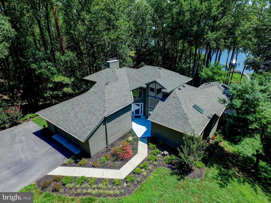 BOATER'S PARADISE !! Large waterfront home on over 2 acres on the Magothy River. FOURTEEN FOOT water depth at end of pier. Commercial grade pier with two slips and lifts - One will hold 60 ft at 80,000 lb / the other 40 ft at 60,000 lbs. Surrounded by agricultural and preserved properties. VERY PRIVATE. With over 5000 sq ft on three levels - this home has a fantastic wide open floorplan designed to take advantage of the spectacular water views from nearly every room. Tremendously solid construction. This is the perfect waterfront for anyone who enjoys boating or simply enjoying the relaxed waterfront lifestyle. Covered screened Porch/Meditation/Yoga Room off master bedroom .. enormous Master Bath with separate shower and soaking tub. Possible 5th bedroom. Numerous decks and plentiful built-ins throughout. Move in ready - or add your own personal touches. Two car garage parking, storage shed, "dog house", and Screened gazebo and sun deck located on the pier. This is what waterfront living is supposed to look like.