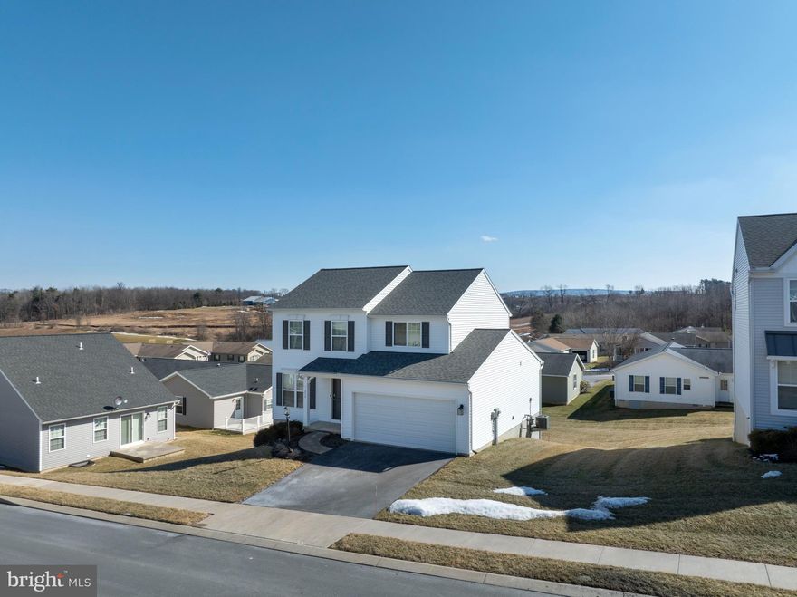 OPEN HOUSE - Sunday, April 12th, 12:00 - 1:30 PM.  Located in the Village of Nittany Glen, this Berks Homes Bellewoode floorplan offers a comfortable two‑story layout with 3 bedrooms and 2.5 baths. The main level is bright with natural light and features open living and dining spaces that connect to a beautiful kitchen with island and sliding doors to the deck. A first‑floor laundry room, half bath and 2‑car garage add everyday convenience. Upstairs, the primary bedroom includes a walk‑in closet and nicely appointed ensuite bath, along with two additional bedrooms and a full bath. The walkout lower level provides excellent storage or future finishing potential. Residents of Nittany Glen enjoy a community clubhouse, fitness room, pool, sidewalks, and green spaces, all within a peaceful neighborhood setting. The location offers quick access to shopping, dining, Penn State, and the State College Regional Airport, making this home a great opportunity in a desirable community. Schedule your showing today!