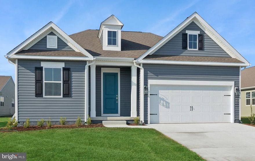 The Daffodil combines an open floorplan with inviting Farmhouse design elements, with a projected settlement date of May 2026. Designed for both style and flexibility, this home features 3 bedrooms, 3 baths, and a 2-car garage.

Warm character details shine throughout the main living spaces, including stained ceiling beams, farmhouse feature walls, and a fireplace with mantel that anchors the great room. Luxury vinyl plank flooring flows through common areas and the primary suite, while guest bedrooms and the finished basement rec room are finished with plush carpet.

The kitchen is thoughtfully designed with floating shelves, dual ovens, and polished Ice White quartz countertops, creating a functional yet elevated space for everyday living and entertaining. Ceramic tile flooring is featured in all bathrooms and the laundry room for added durability.

The finished basement includes an additional bathroom, expanding the home’s living space, while the primary bath offers a plus-size shower for a spa-inspired retreat.

For a full list of features for this home, please contact our sales representatives.
Photos are for illustrative purposes only and may not represent the exact home or finishes available.

Welcome to a new active adult 55+ community in Magnolia, DE, offering low-maintenance, resort-style living with beautiful single-family new homes. Enjoy amenities including a luxurious clubhouse, pickleball courts, and a pool with cabanas and tiki bar. Here you can enjoy the company of people who have worked hard and now want to enjoy all that a luxury community has to offer. The low-maintenance lifestyle assures that your lawn care is out of your hands, keeping you free to spend time with friends at the clubhouse or at the nearby beaches. Just minutes from Route 1 in Delaware with tax-free shopping, dining and entertainment, this 55+ active adult community offers everyday convenience together with the serenity of a picturesque Delaware landscape. The relationships that you make and the people you spend time with here will create memories for years to come.