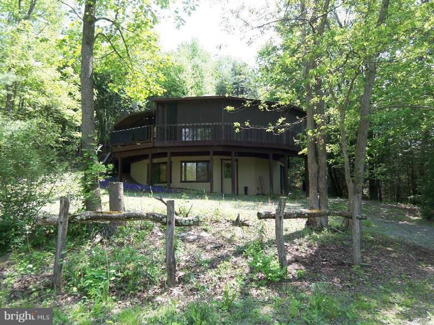 The driveway is round, the cul-de-sac is round and so is the house. You will love the country setting of this custom built very private 4 bedroom 3 full bath home on 2.99 open and wooded acres with frontage on the Sleepy Creek. The master bedroom on the upper level has shower and Jacuzzi tub. The field in front of the house is fenced for horses and it's just a short distance. Motivated Seller.