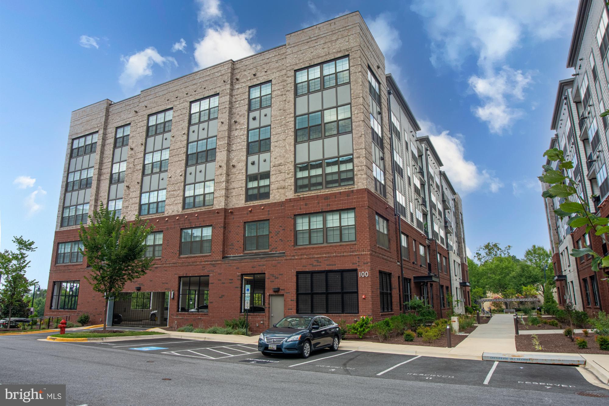Welcome to 100 Saint Ives Place, Unit 205 — a stunning 2-bedroom, 2-bath condo with a bonus den, nestled in the heart of National Harbor! Boasting 1,500 square feet of stylish living space, this move-in ready unit features a gourmet kitchen with quartz counter tops, stainless steel appliances, a five-burner gas stove, large pantry, recessed and pendant lighting, and ample cabinetry — perfect for cooking and entertaining alike.
Luxury vinyl plank flooring flows throughout the main living areas, with plush carpeting in both bedrooms. The spacious primary suite offers a huge walk-in closet, linen storage, and a spa-inspired bath with frameless glass shower.
Enjoy your morning coffee or unwind in the evening on the private balcony with views of the vibrant National Harbor. Additional highlights include in-unit laundry, extra storage, wall-mounted TV setup ready to use, and a secured building with intercom and smartphone access for guest entry. Assigned garage parking and additional secured surface parking complete the package.
Experience upscale living just steps from the shops, dining, and waterfront lifestyle of National Harbor. Schedule your tour today — this one won’t last!