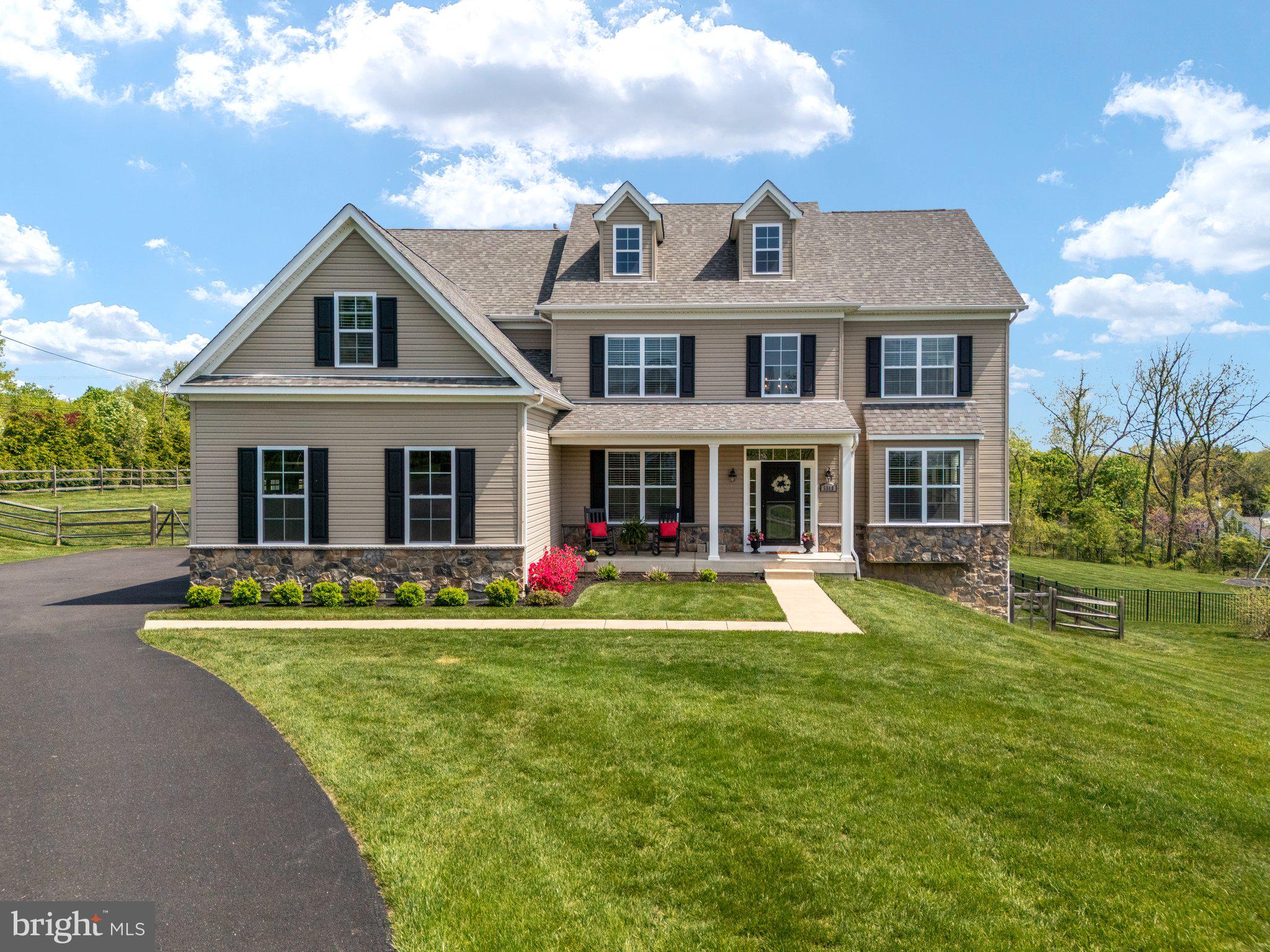 Built in 2018 and nestled on just over an acre, this 4-bedroom, 3.5-bath home offers an open and airy floor plan with high ceilings and sunlit rooms throughout. The gracious foyer welcomes you into a private first-floor study. The spacious living and dining areas are perfect for entertaining or relaxing at home and flow seamlessly into the Kitchen. The gourmet kitchen features stainless steel appliances, neutral finishes, and plenty of space for meal prep and gatherings. Adjacent to the kitchen is a stunning sunroom with windows on every wall, filling the space with natural light and providing views of the expansive backyard. A sliding glass door opens to the patio and firepit—ideal for enjoying warm evenings outdoors. Upstairs, you'll find four generously sized bedrooms, a large hall bath, and a spacious second-floor laundry room. The grand primary suite includes a luxurious ensuite bath and ample closet space. A walk-up attic provides additional storage or potential for future use. The finished, lower-level walkout offers even more living space, a full bath, and high ceilings perfect for a rec room, gym, or guest suite. Lovingly maintained and move-in ready, this home has the space, function, and charm you've been looking for—all in a fantastic Doylestown location. The backyard is a dream for hosting summer BBQs, family gatherings, or simply relaxing in your private oasis. Additional highlights include a whole-house generator for peace of mind. The house is minutes from Doylestown, shopping, and restaurants. The square footage does not include the finished basement.